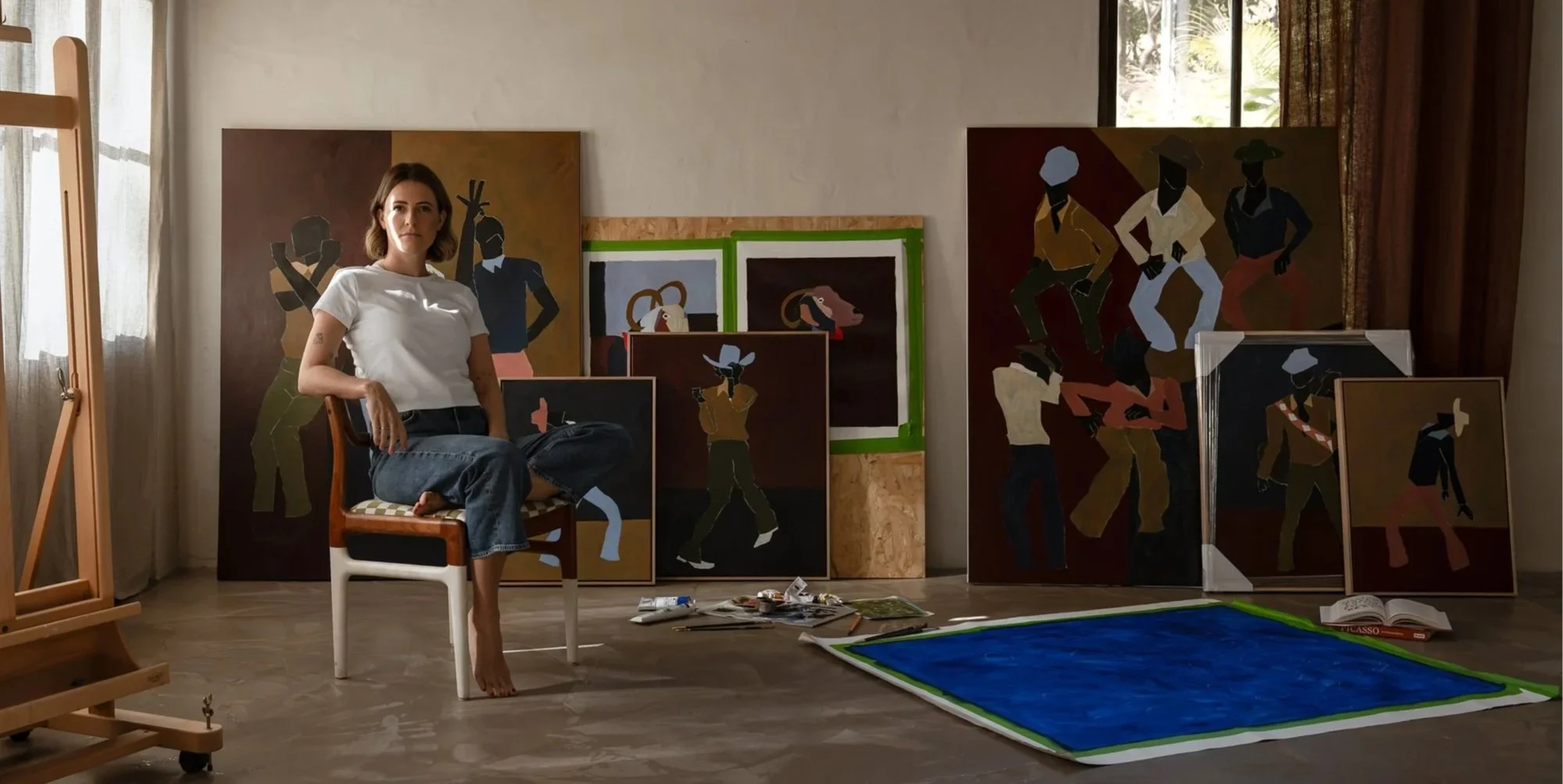 Gold Coast artist Polly Dawson surrounded by her artwork during a branding photography shoot at Barcola Studio