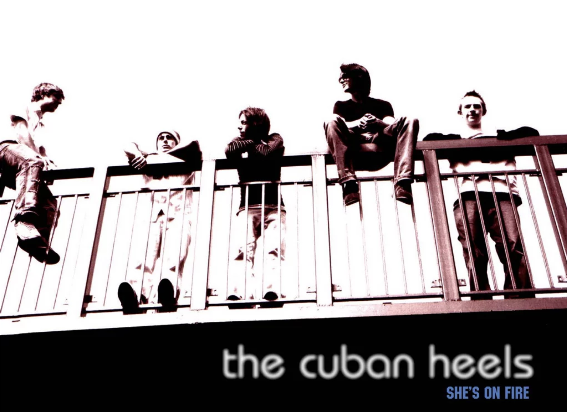 High-contrast image of five people sitting and leaning on a metal railing, with text "the cuban heels" and "she's on fire" below.