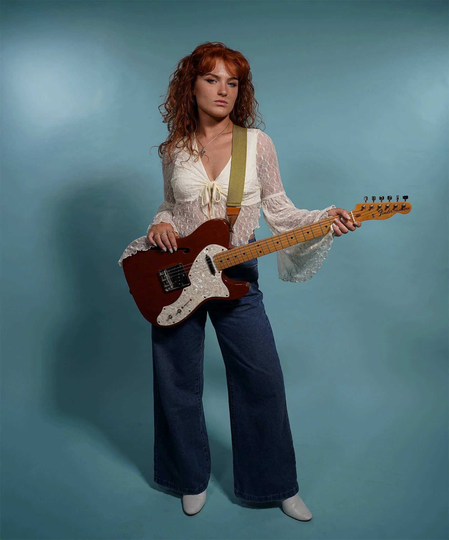 Chloë Wilson 70s Photoshoot Guitar Stood.jpg