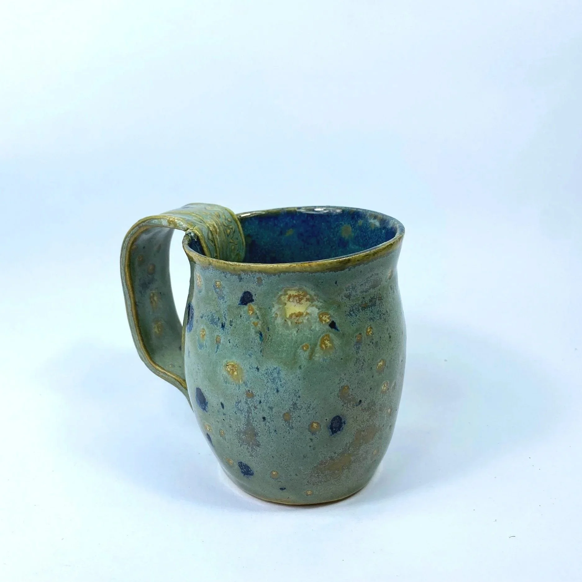 Aurora Green-floating blue mug with Designer handle
