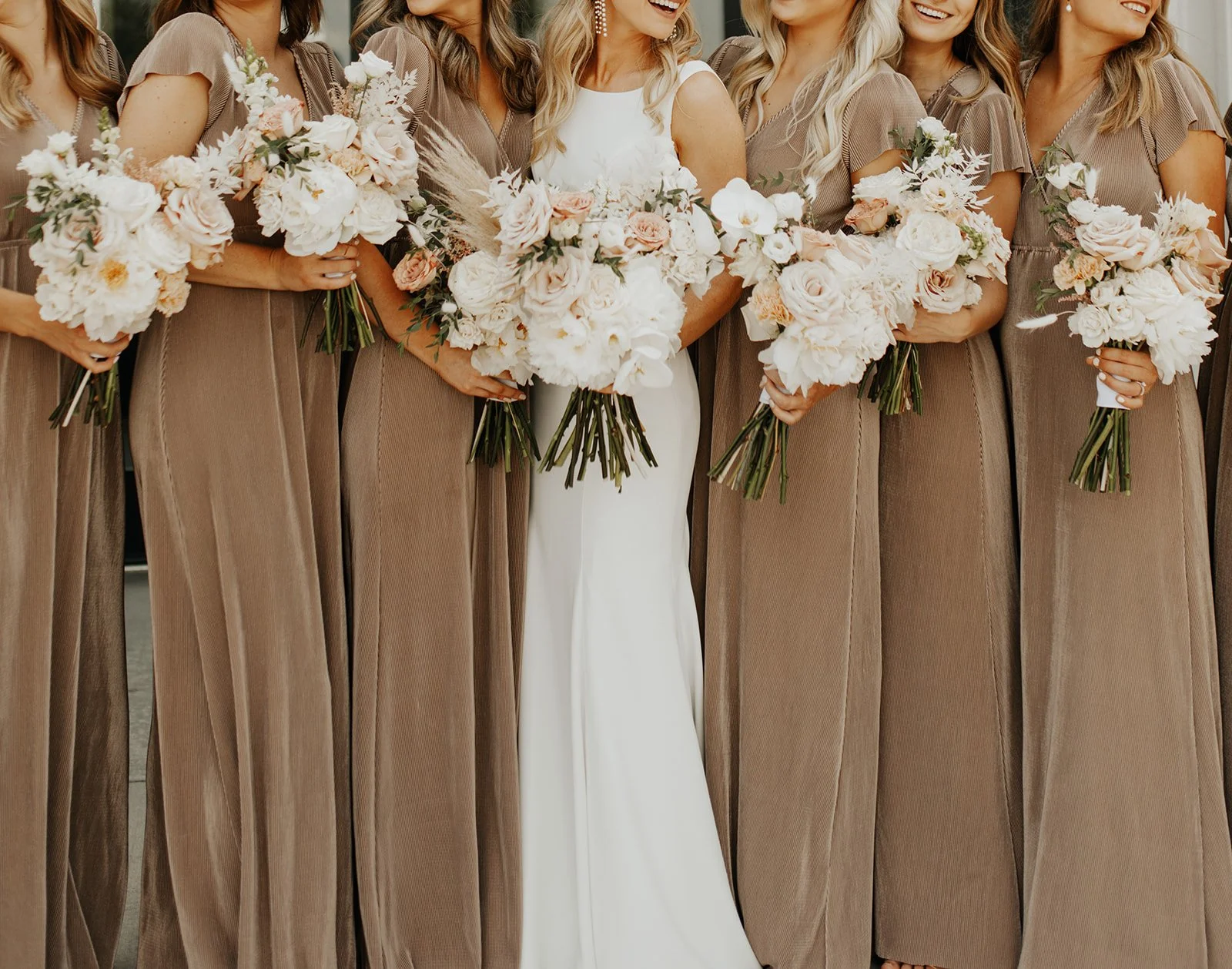Bride and Bridesmaid neutral textured bouquets at woodhaven event center