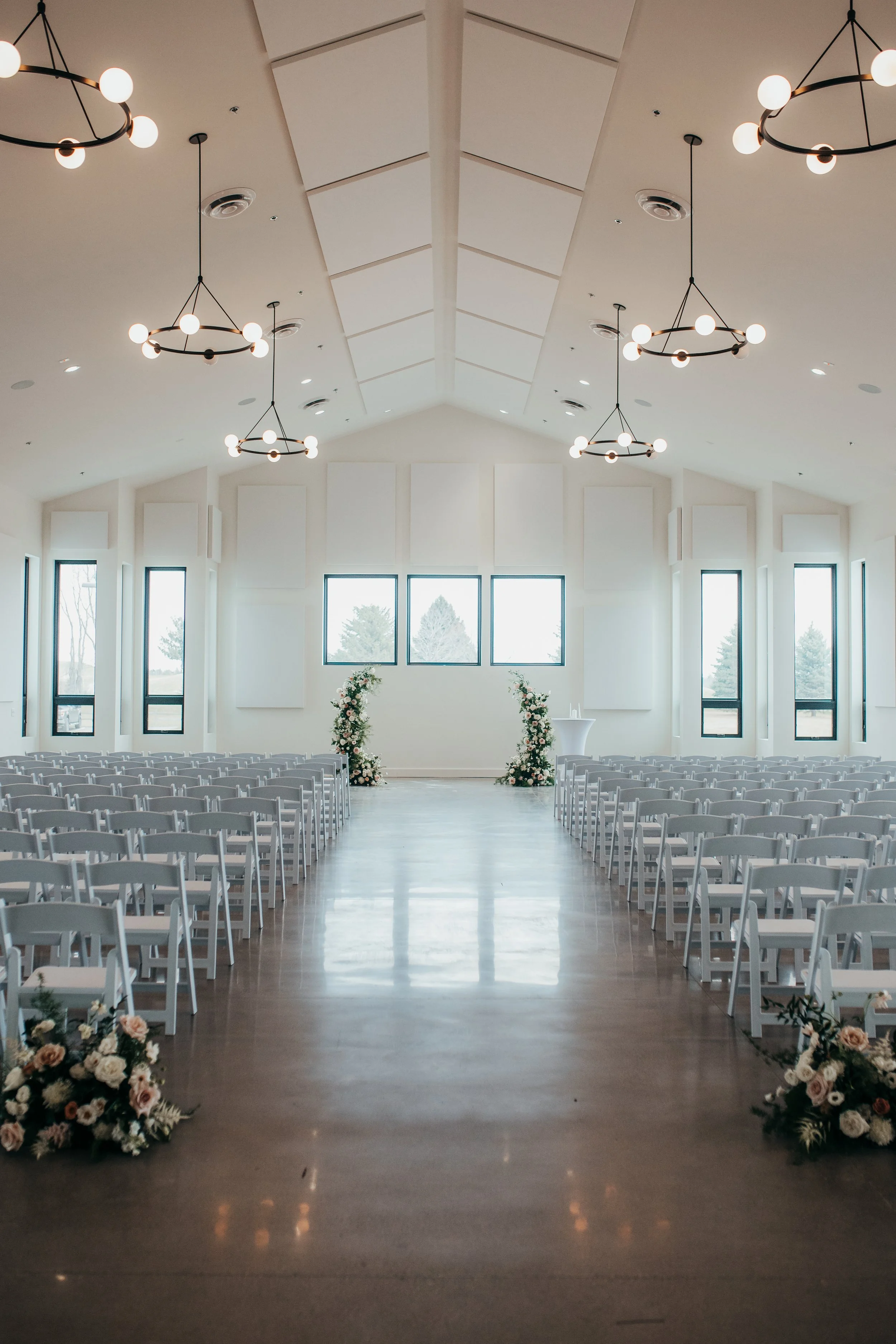 Wedding ceremony asymmetrical floral arbor