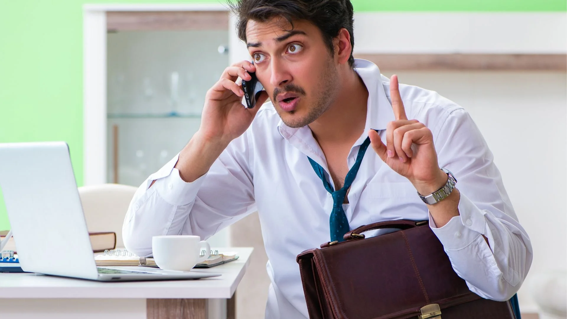 stressed man in a business suit making an urgent phone call, representing immediate emergency respite care services.