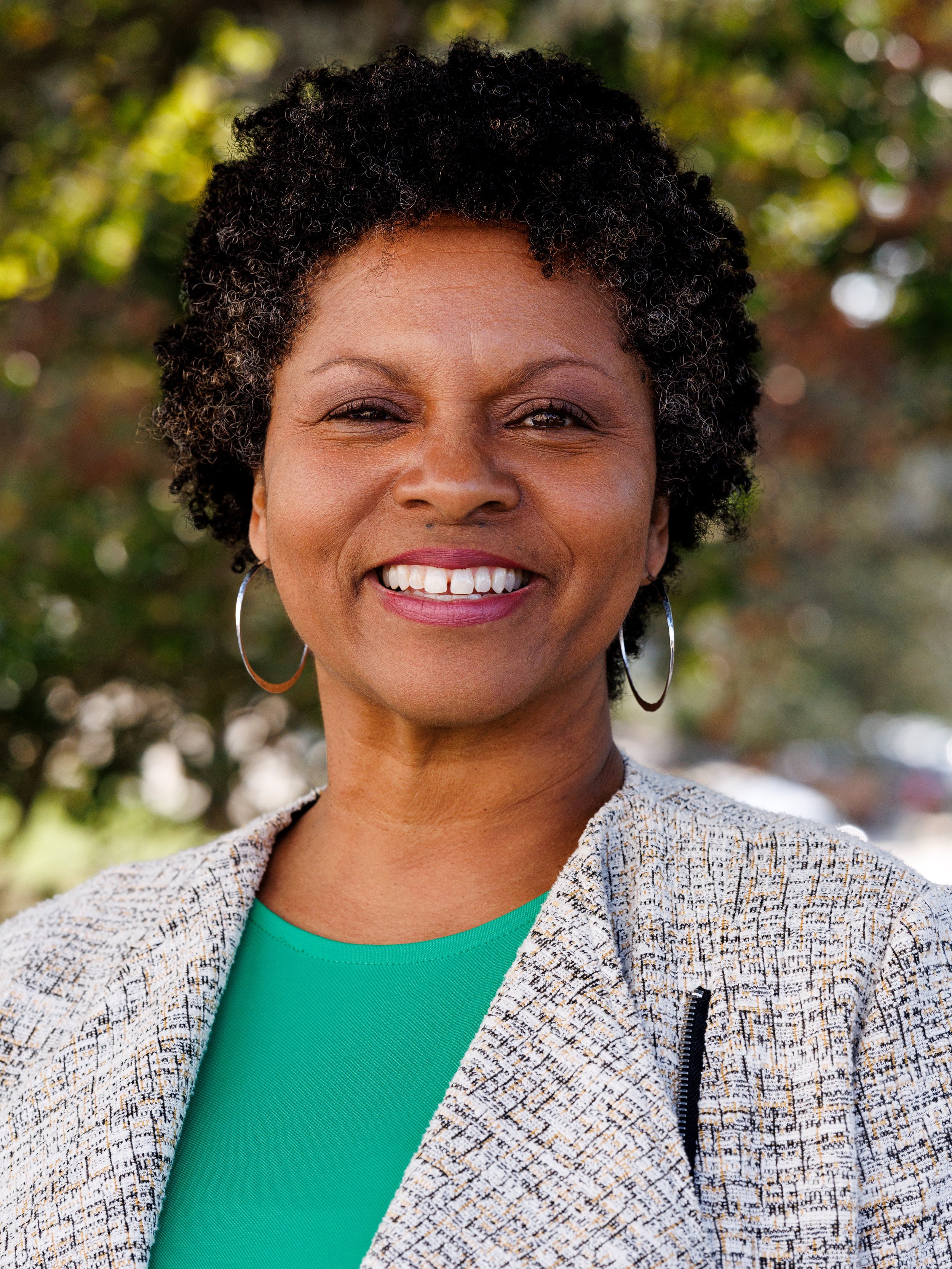 Professional headshot of female Law Professor, taken on site with natural lighting