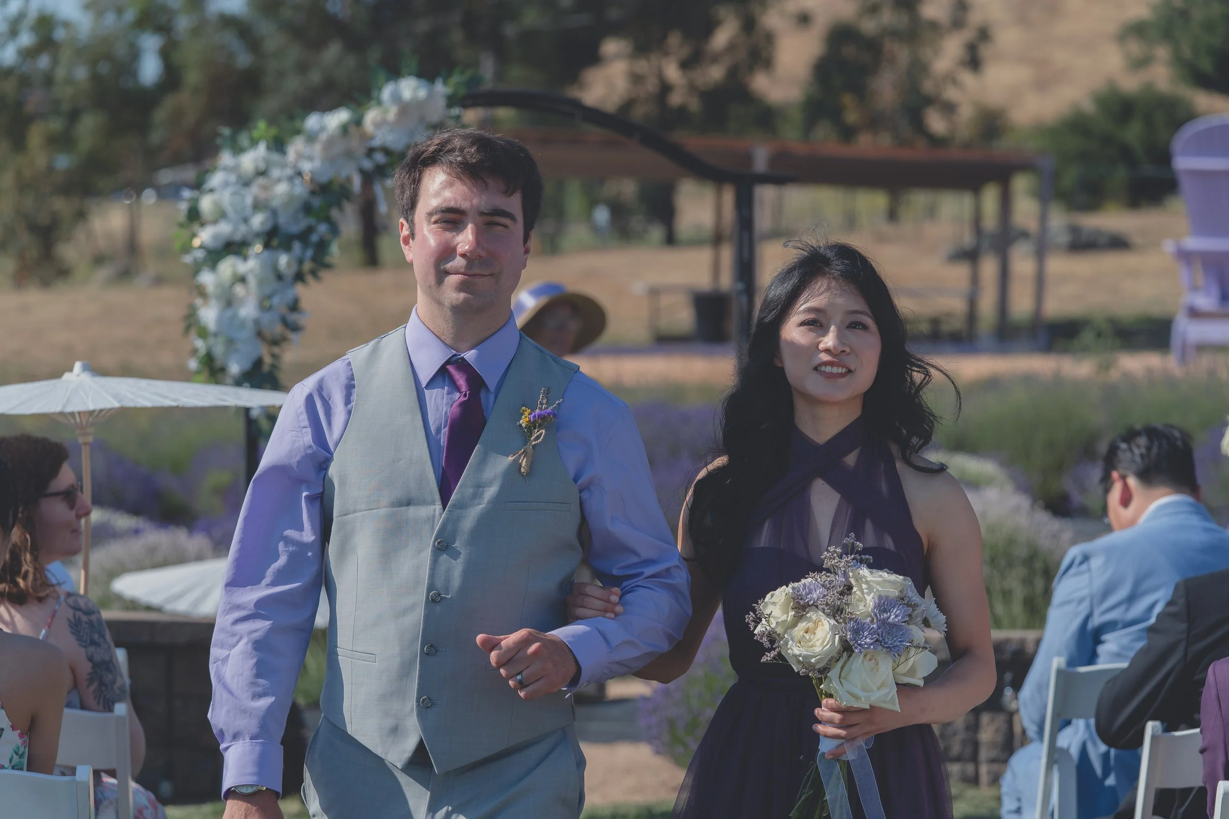 Bride and groom posing together shortly after the ceremony in Sonoma.