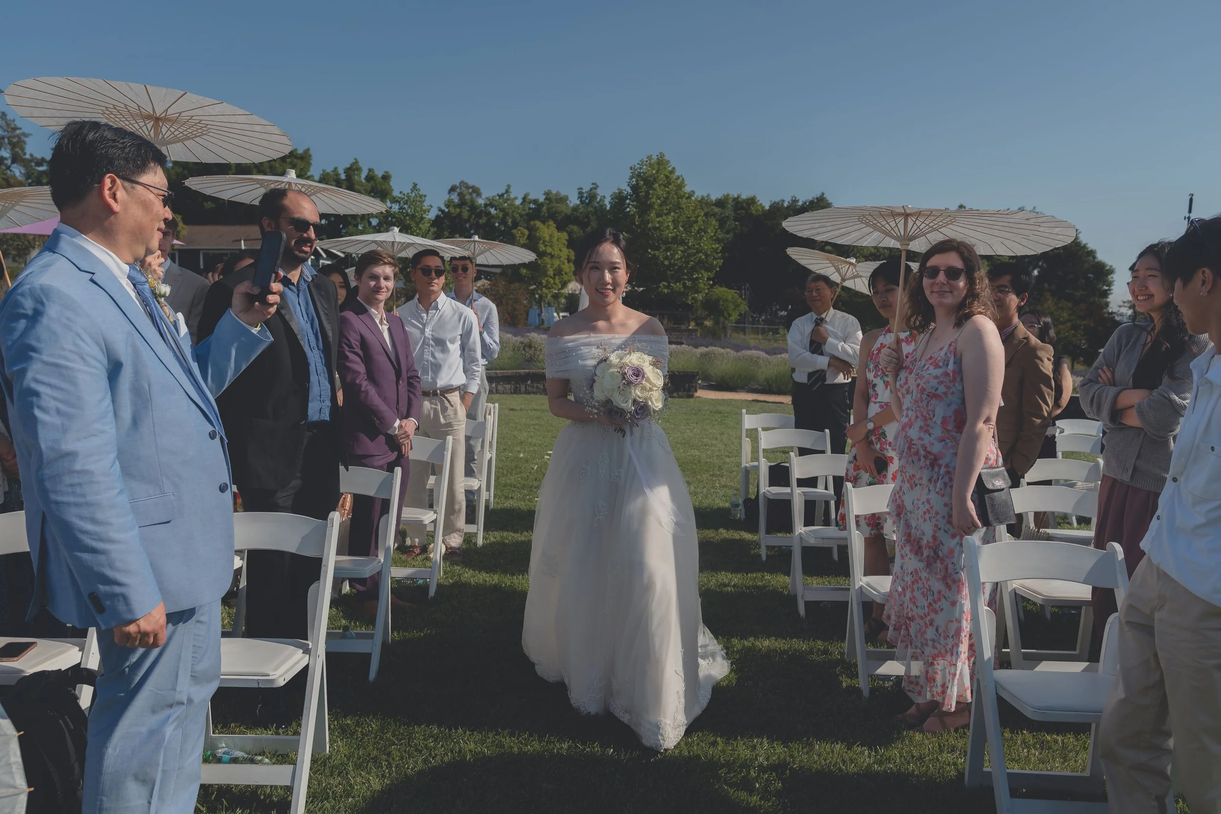 Bride captured in soft natural light while walking down the aisle in Sonoma.