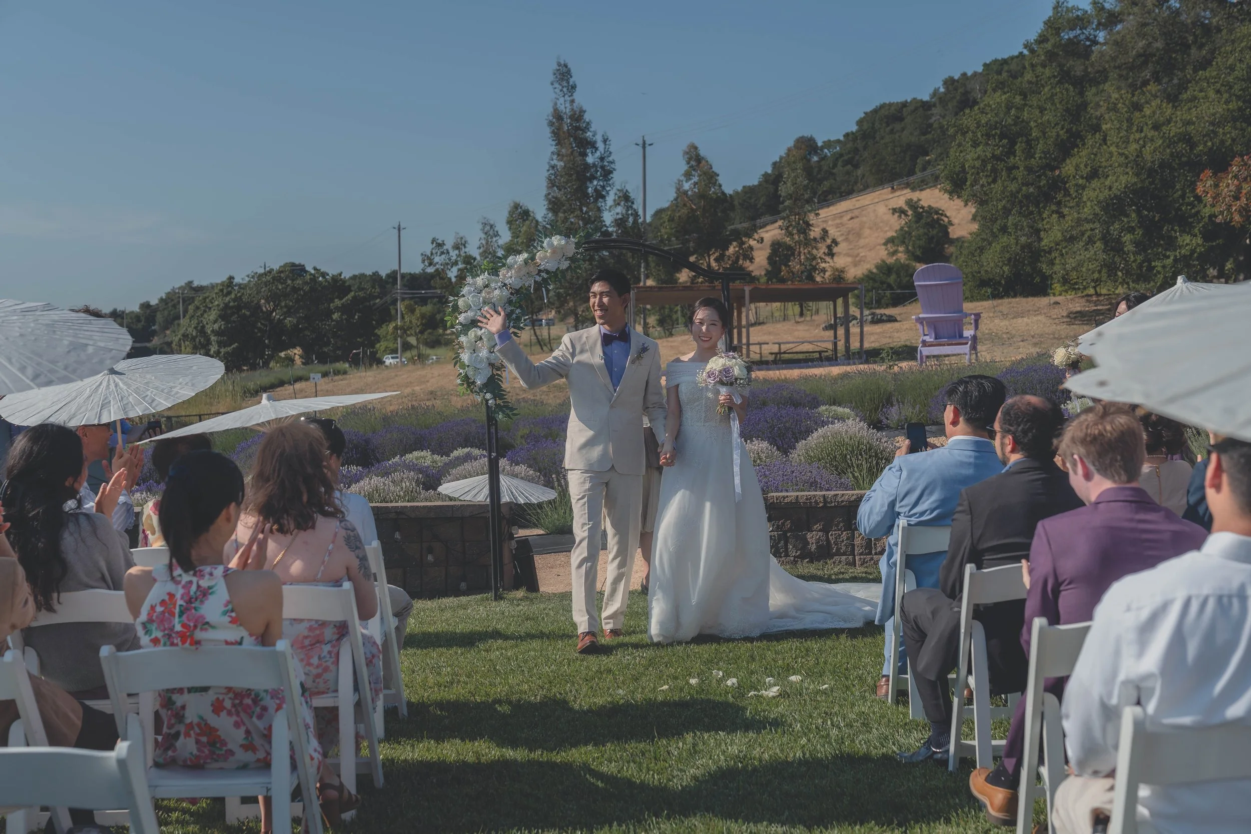 Guests watching as Katherine and Calvin are pronounced married at their Sonoma wedding.
