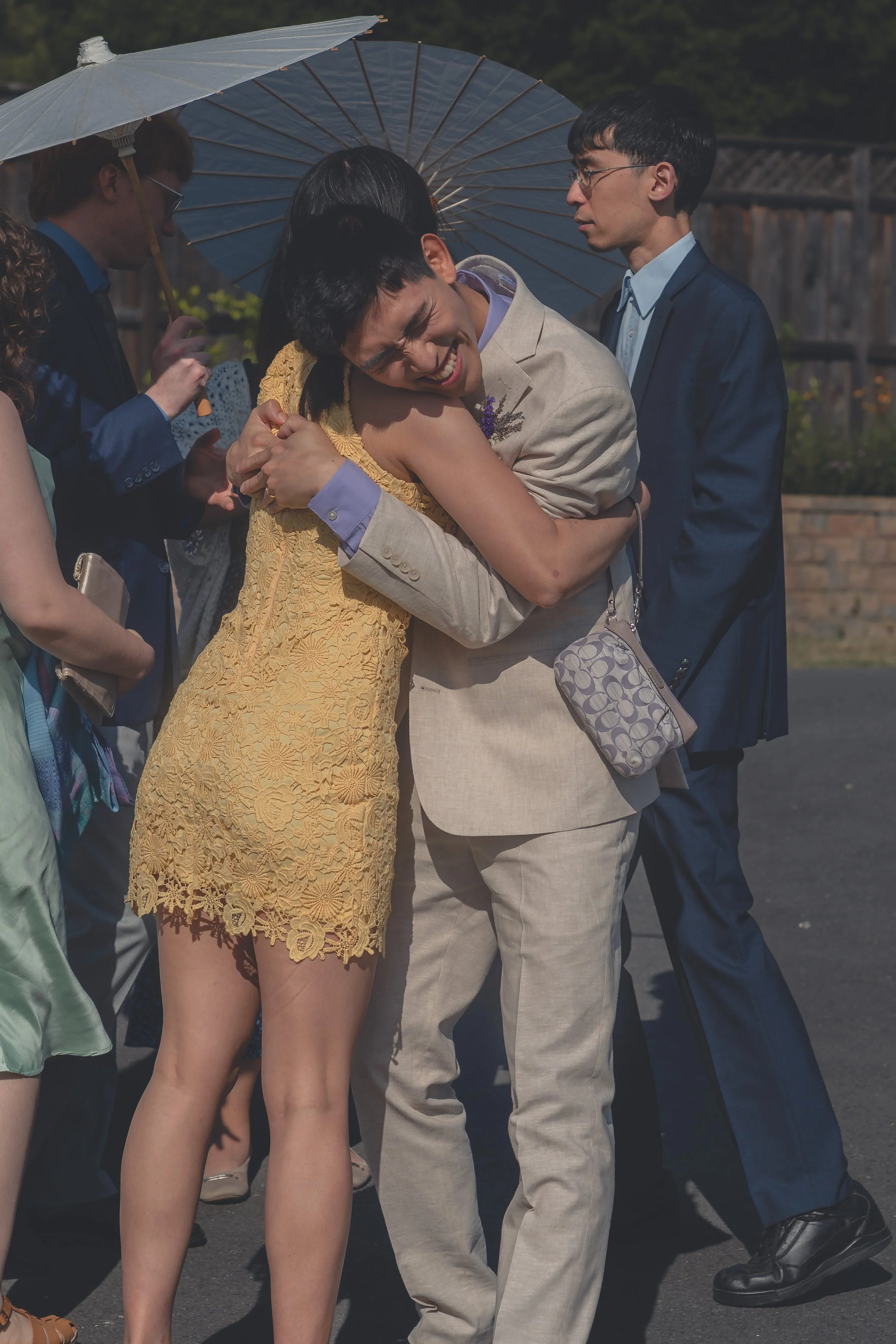 Emotional embrace shared between guests after the ceremony in Sonoma.