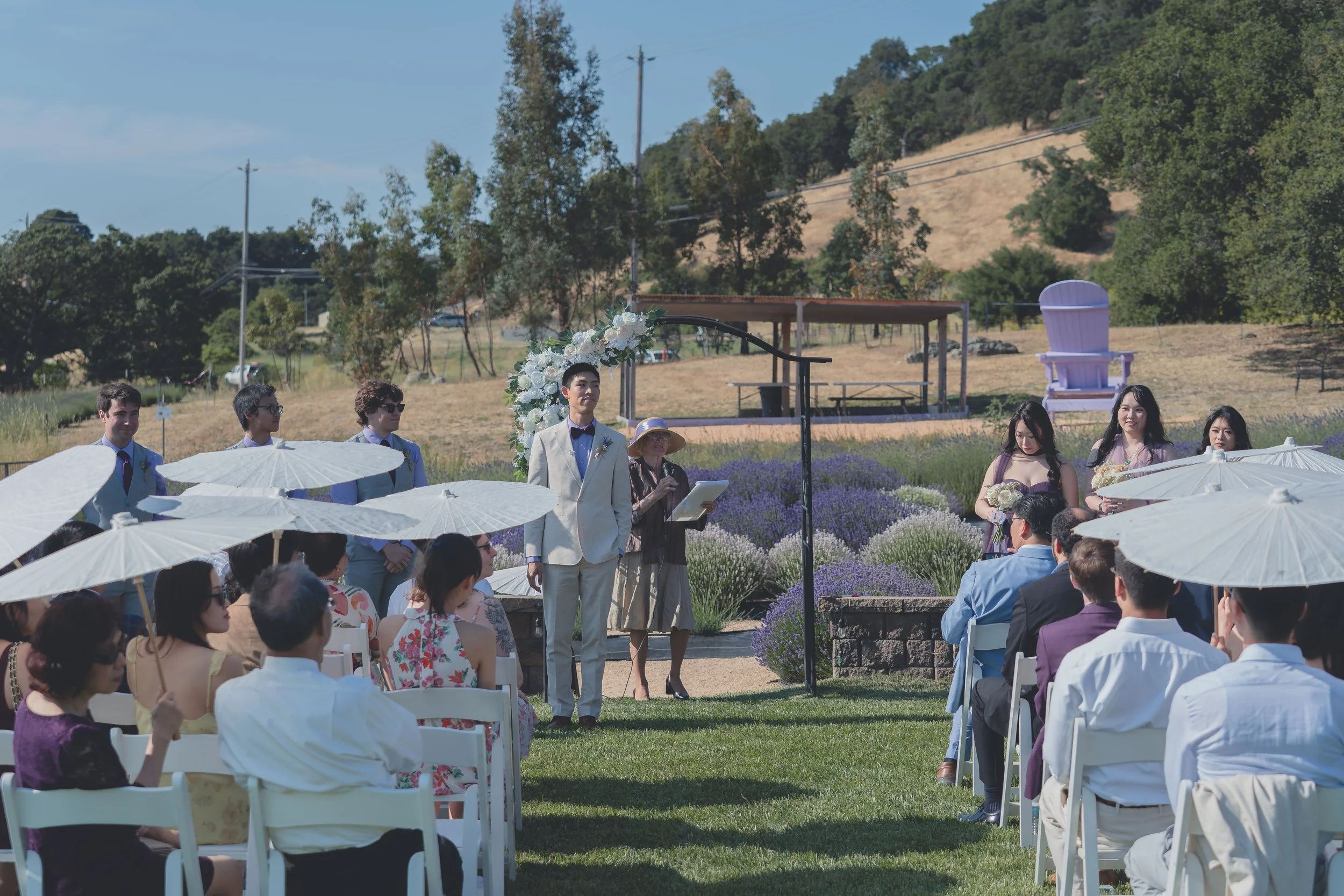 Guests watching as the wedding party processes down the aisle at a Sonoma wedding.