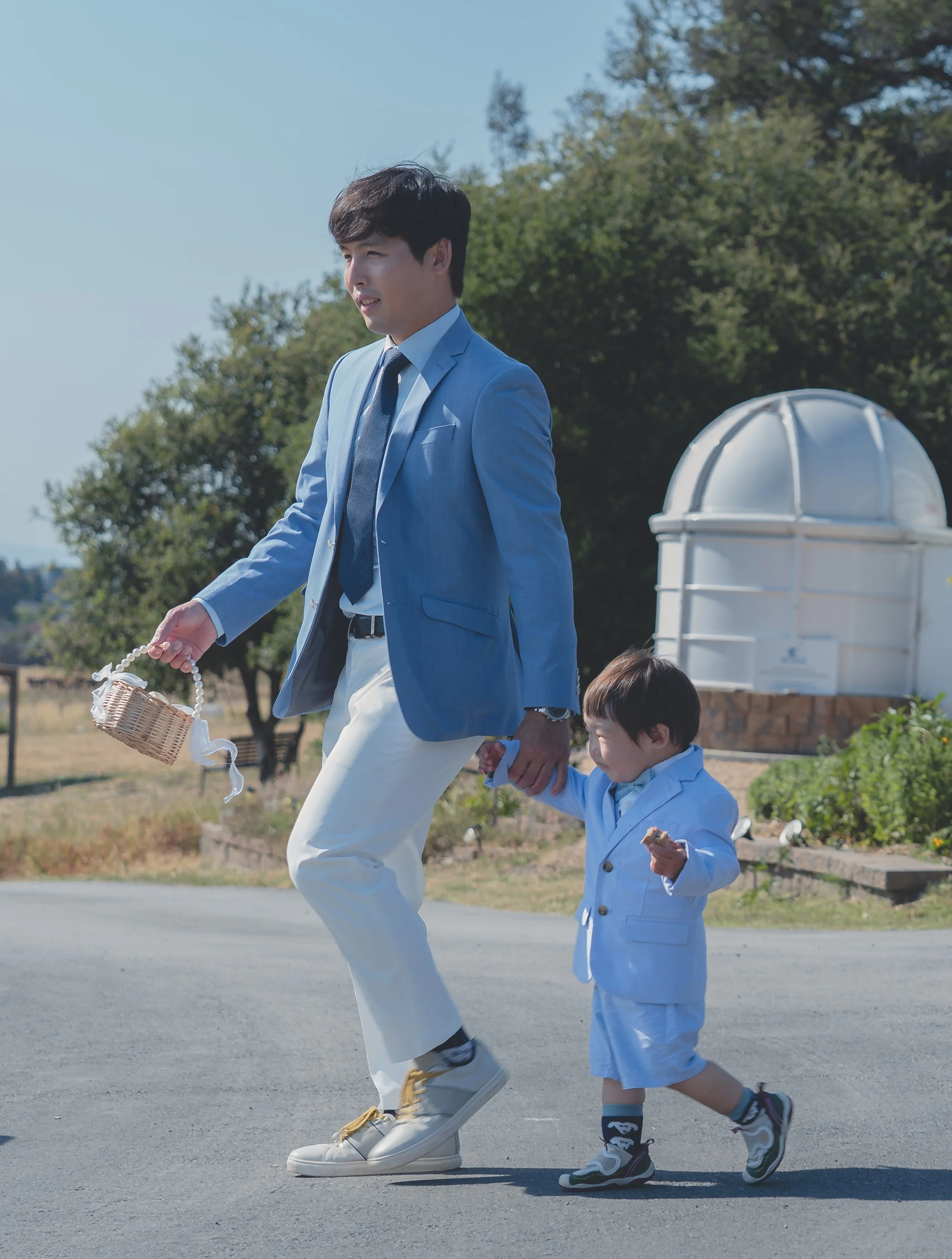 Wedding guests walking across the venue grounds in California wine country.