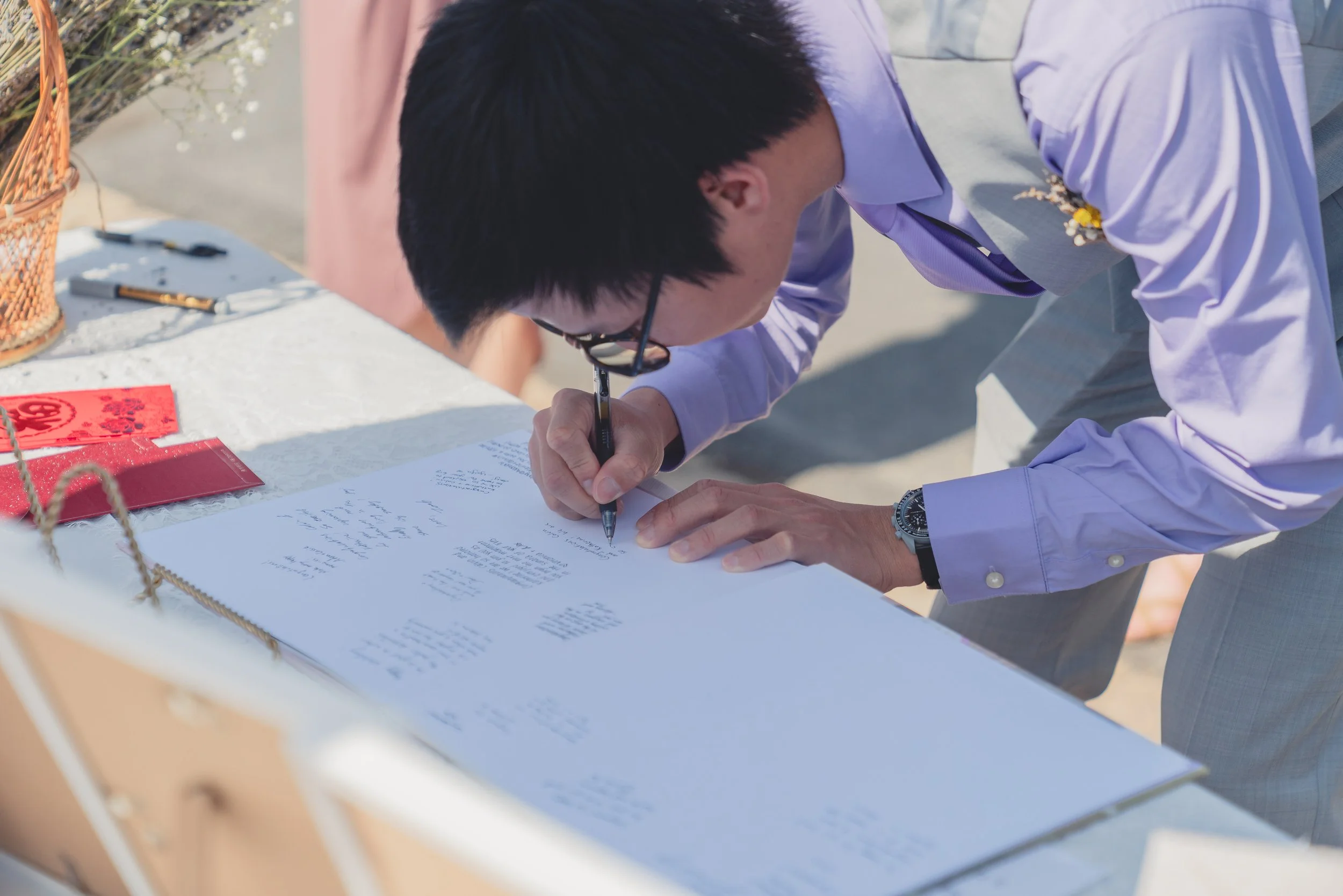 Wedding guest signing and interaction captured during a Sonoma celebration.