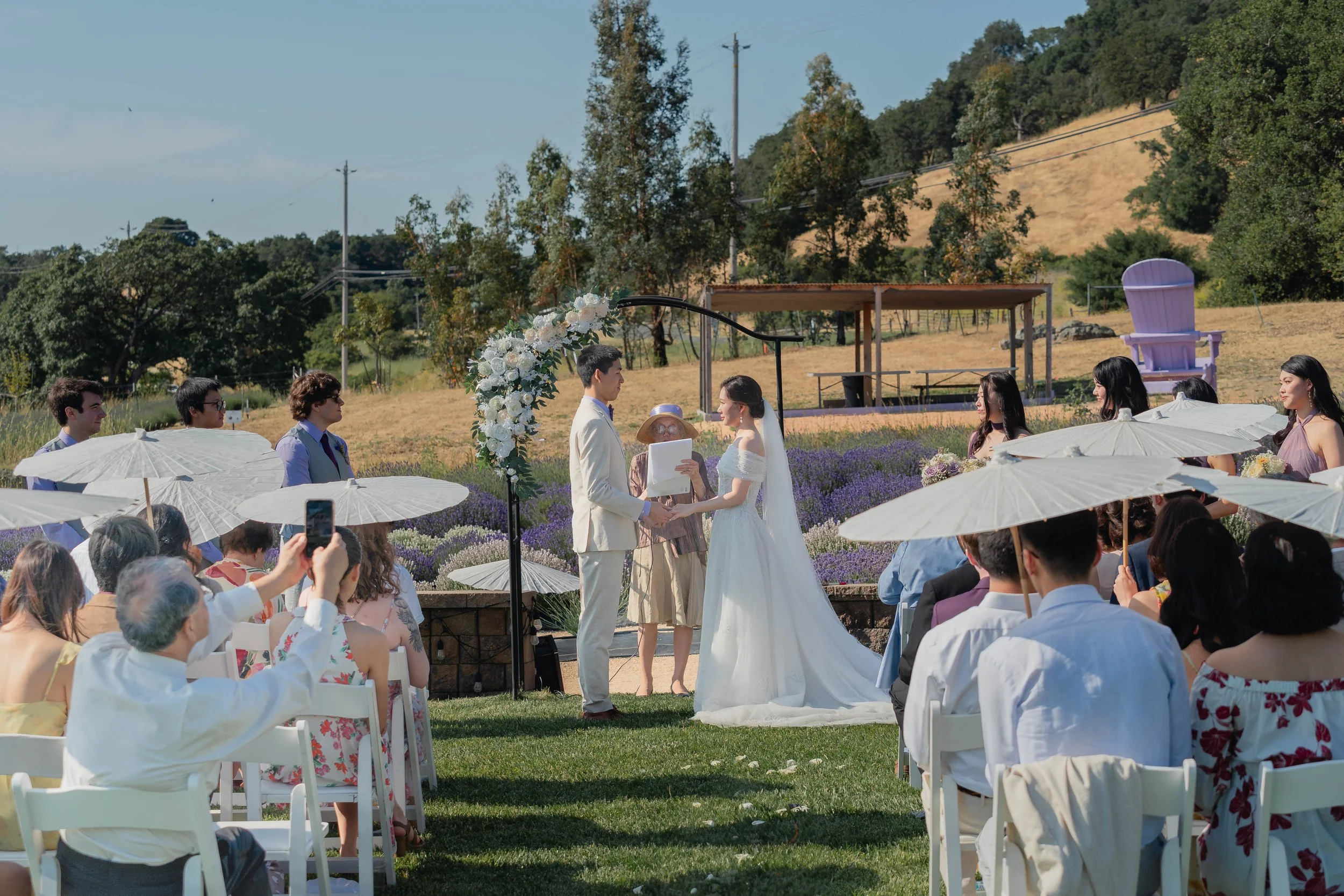 Bride and groom listening attentively during the wedding ceremony in Sonoma.