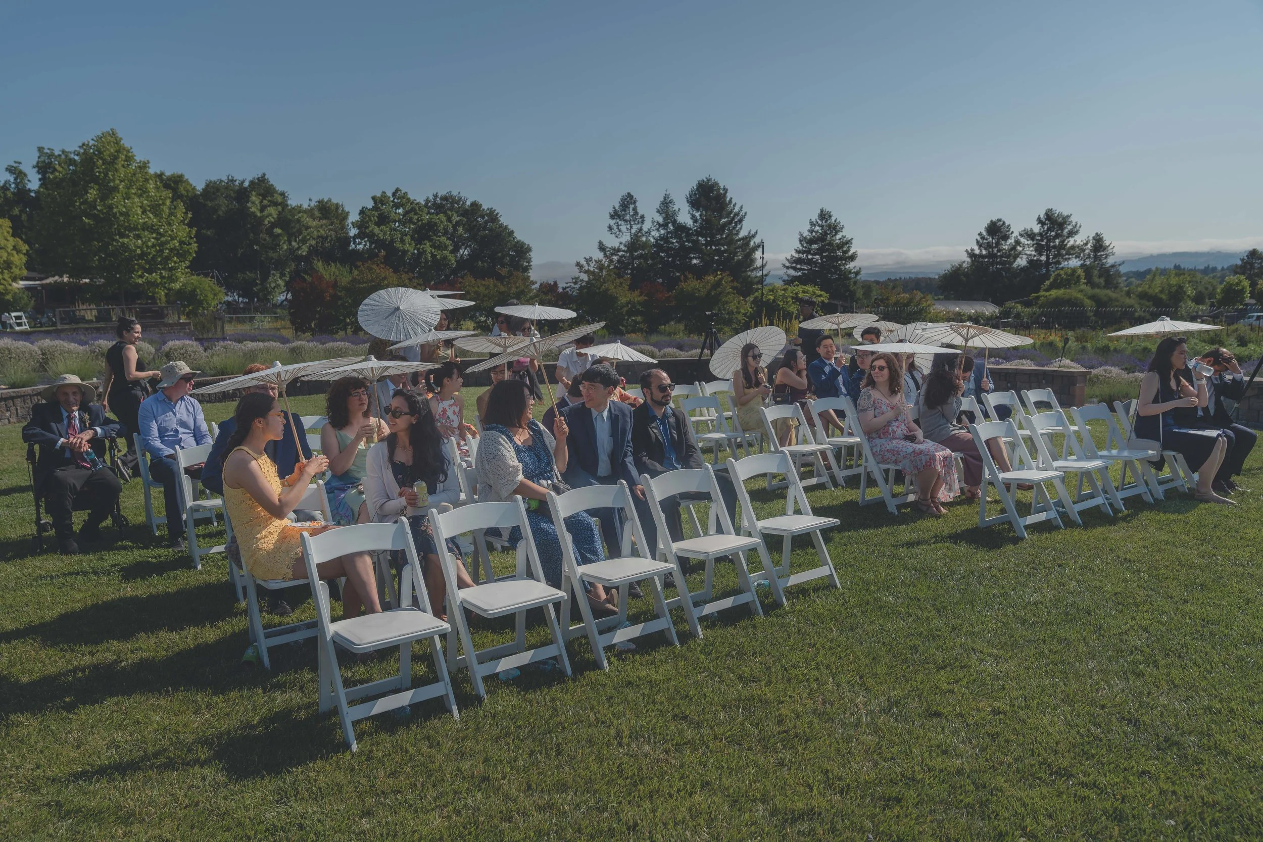 Wide view of guests seated for the ceremony at a Sonoma wedding venue.
