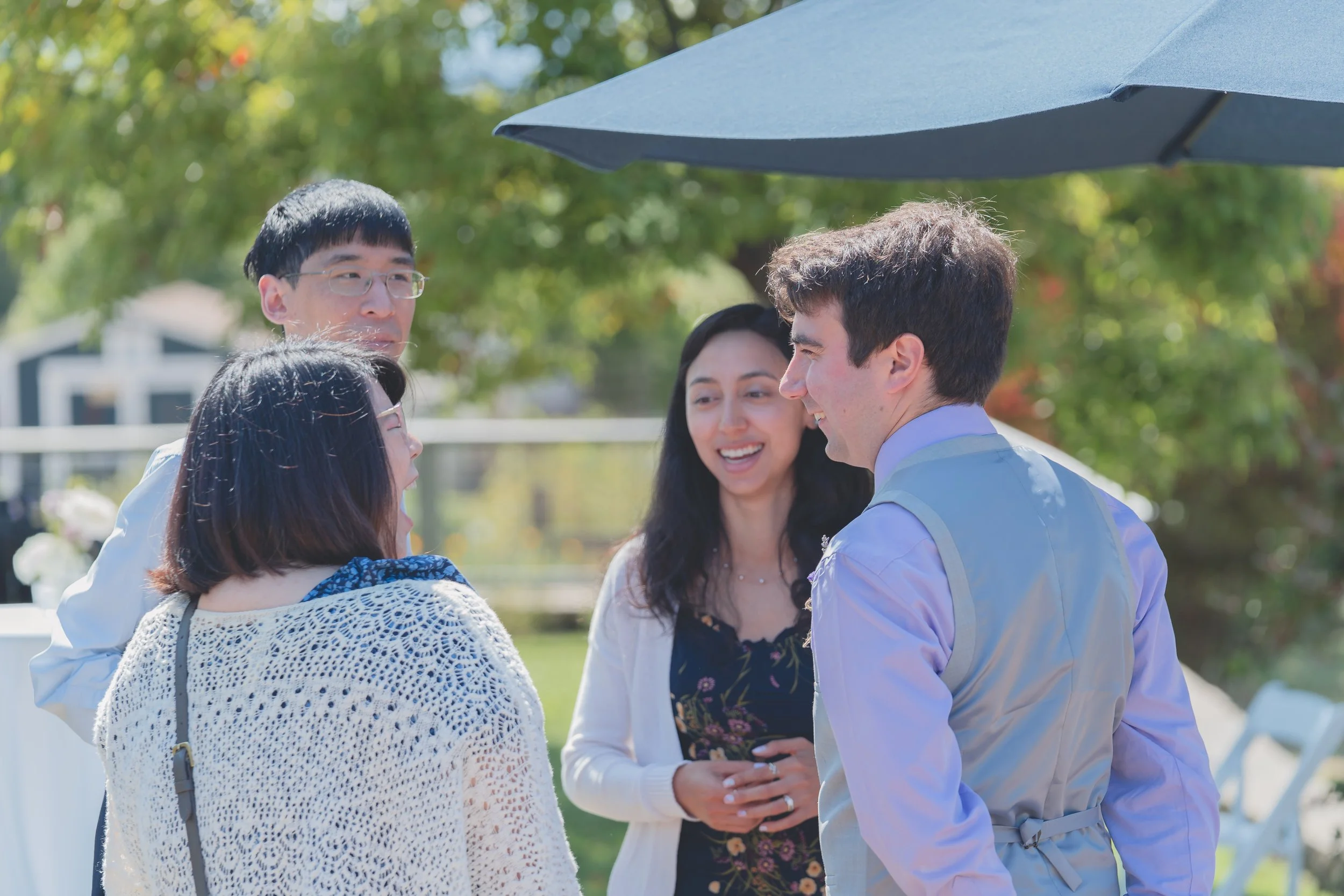 Guests sharing a candid moment before the ceremony at a Sonoma wedding.