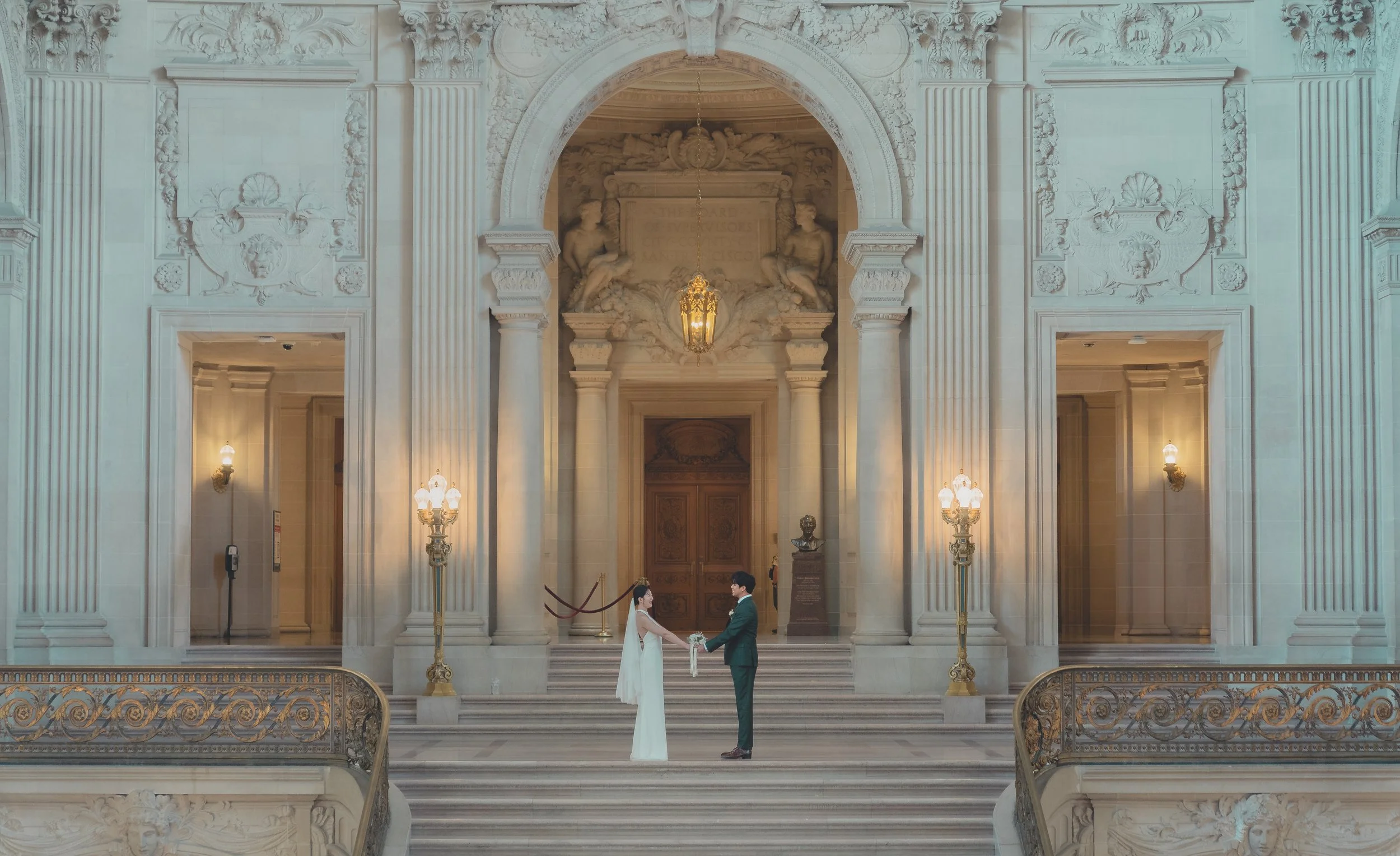 Grand marble staircase inside San Francisco City Hall showcasing the historic architecture.