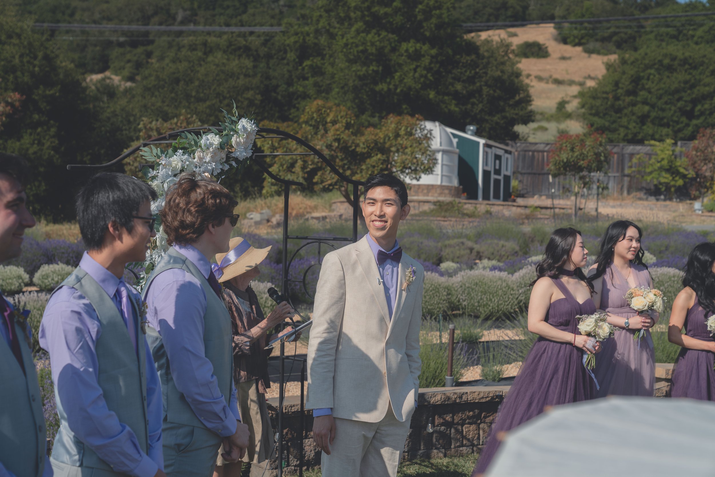 Wedding party members standing beneath the open sky during the Sonoma ceremony.