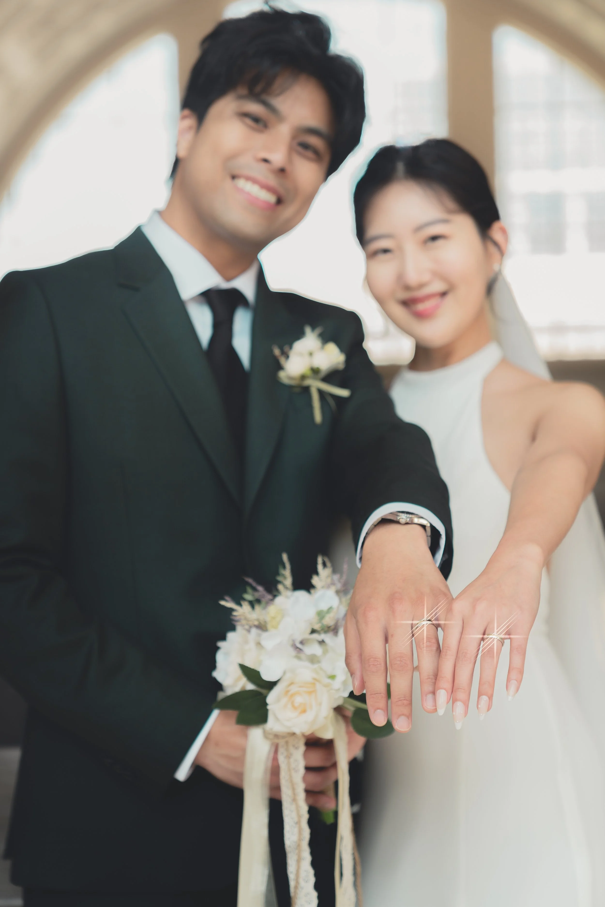 Bride and groom showing their wedding rings during a San Francisco City Hall wedding.