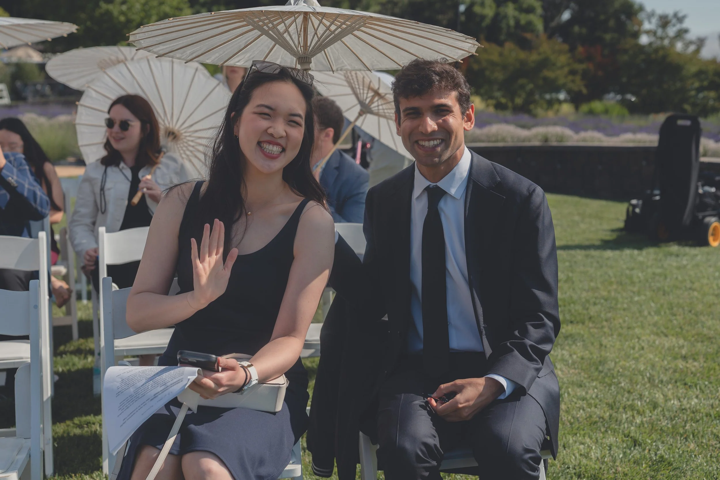Guests seated together during the wedding ceremony in California wine country.