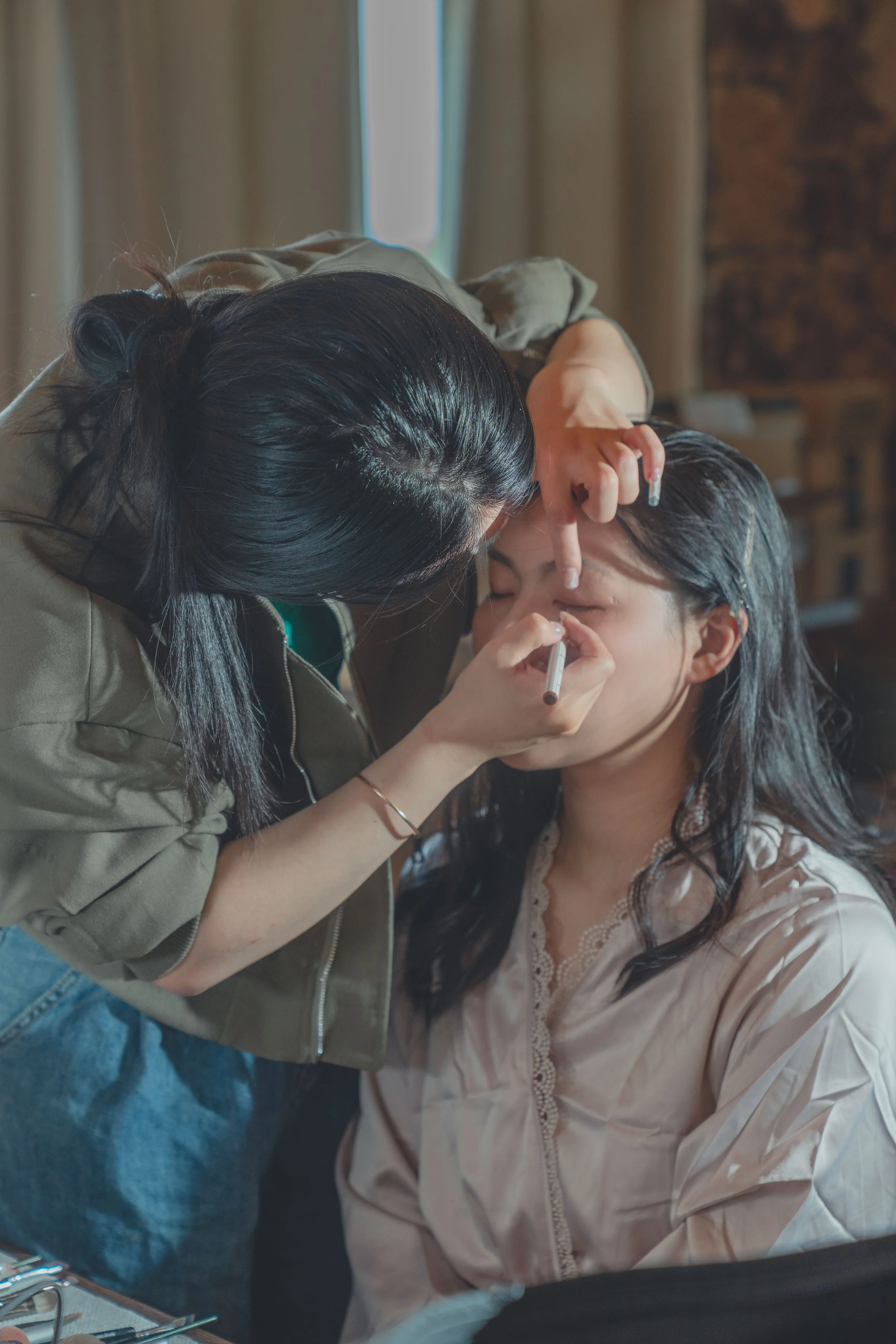 Bridemaid during hair and makeup, photographed with a natural, documentary style in Sonoma.