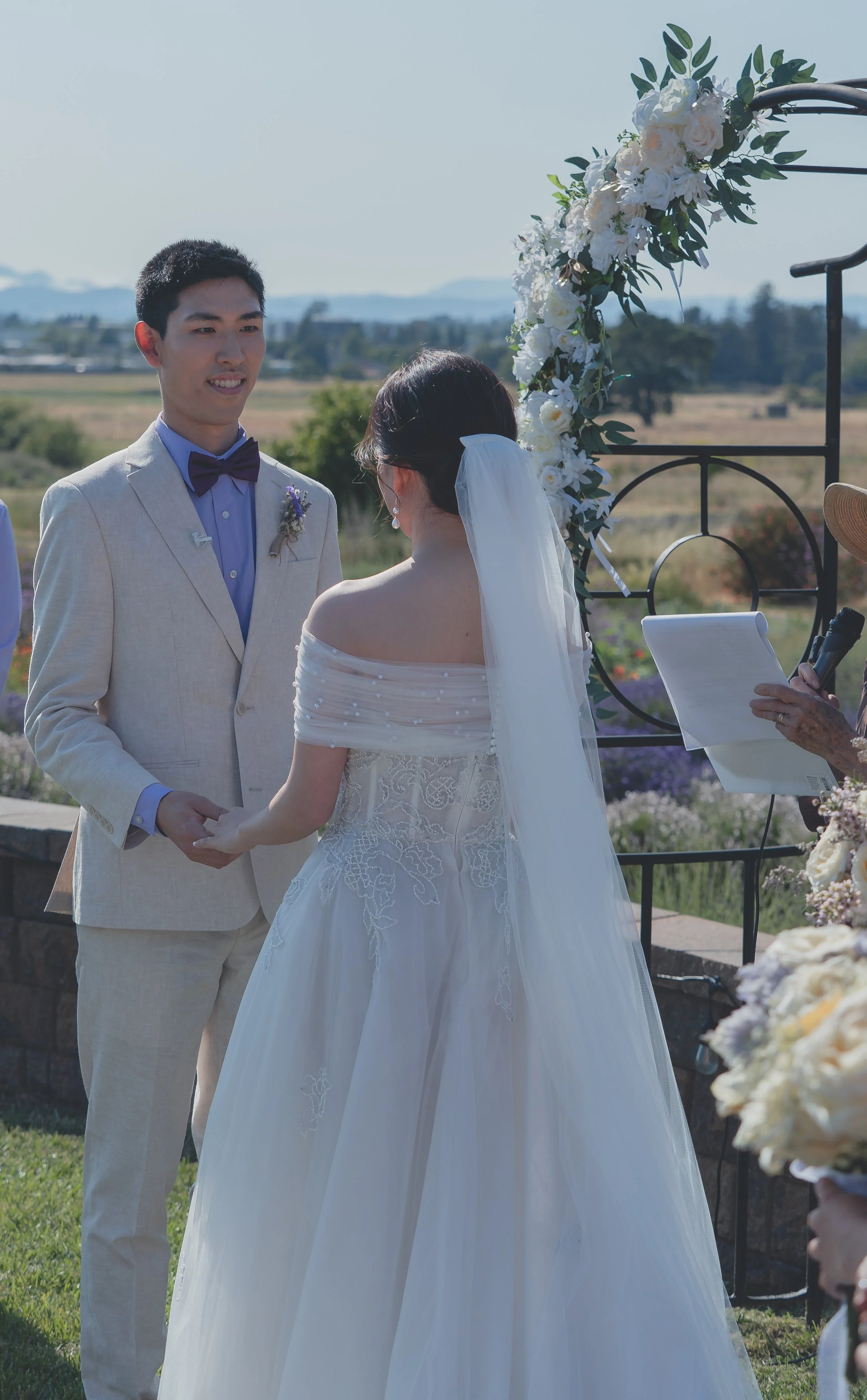 Bride standing beside the groom moments after entering the ceremony at a Sonoma wedding.