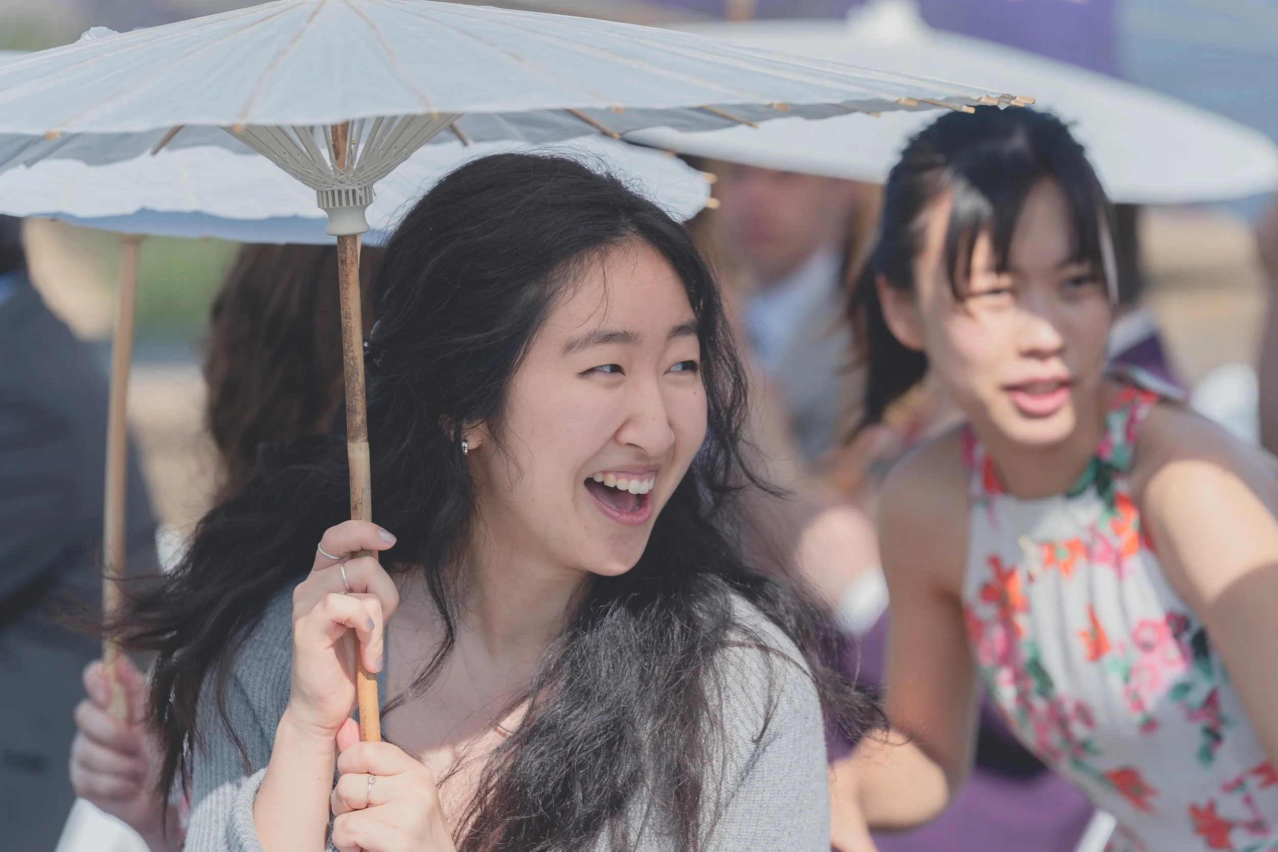 Guests sharing laughter and conversation during a Sonoma wedding ceremony.