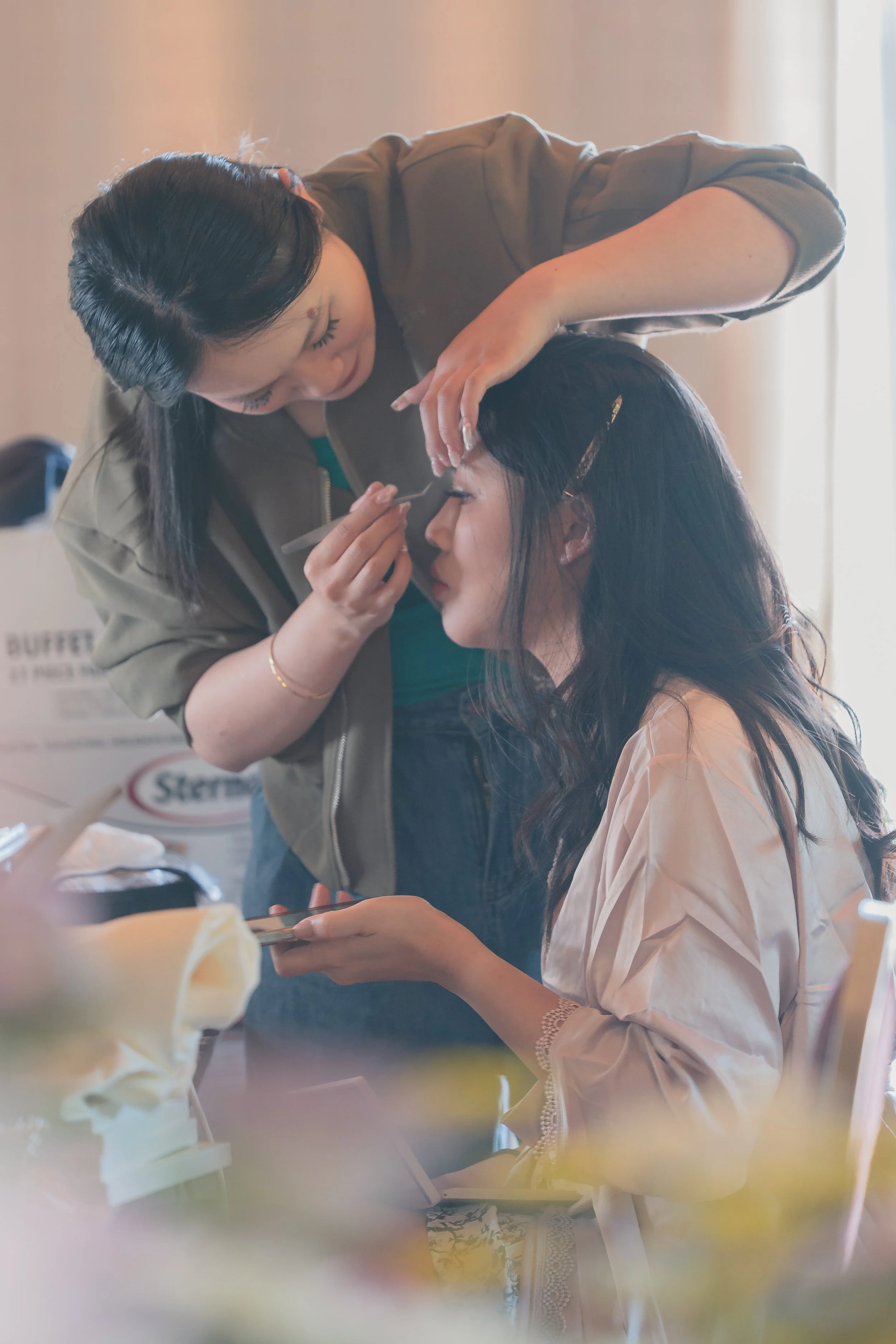 Intimate candid moment captured during groom preparations at a Sonoma wedding.