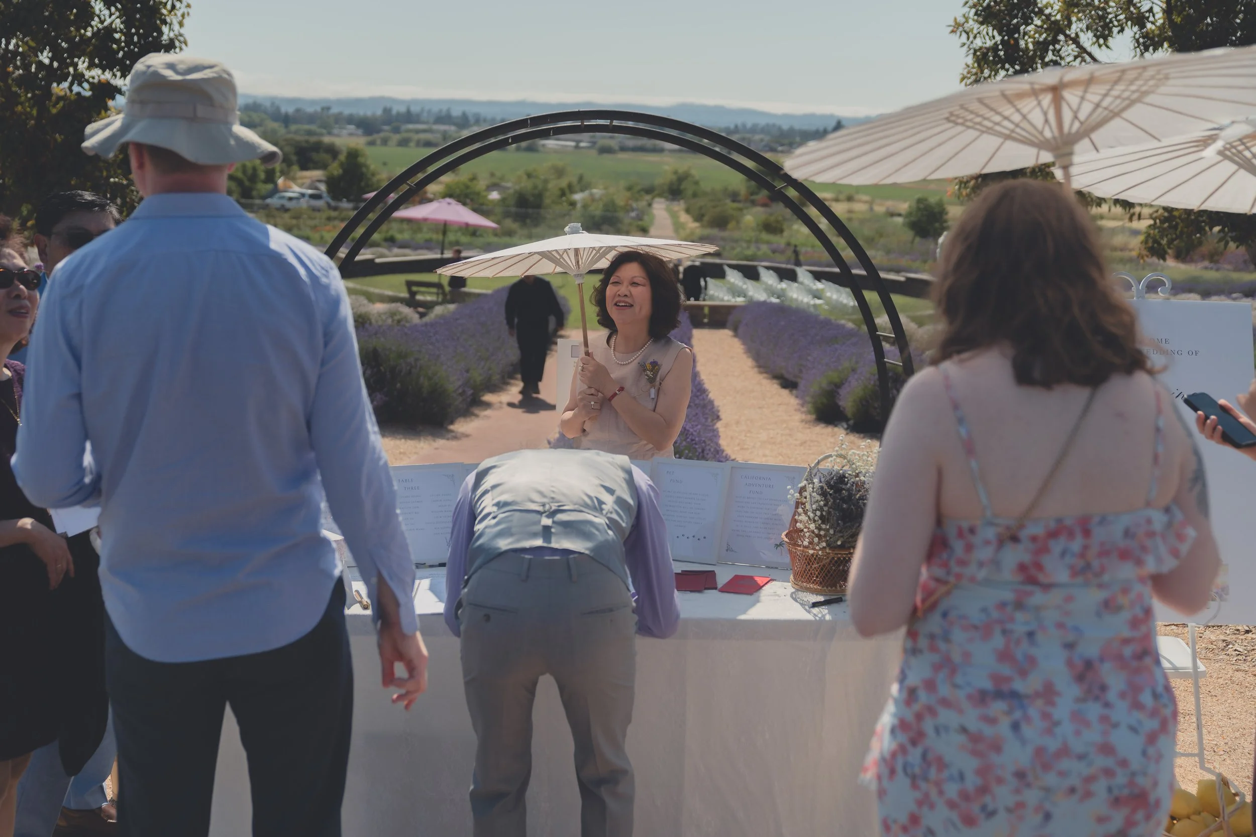 Guests walking through the venue grounds during a Sonoma wedding.