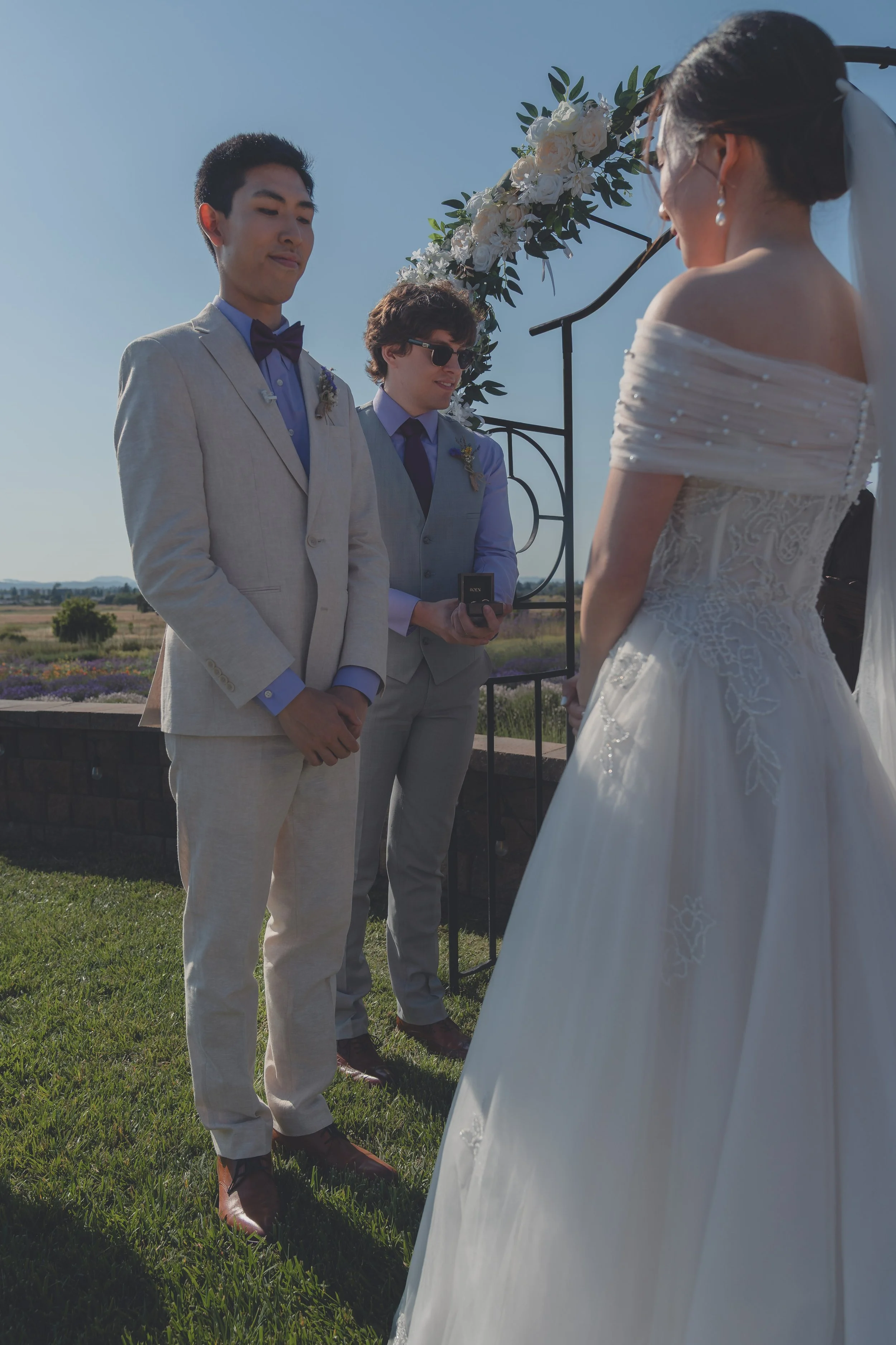 Bride and groom standing together in a quiet moment during the ceremony in Sonoma.
