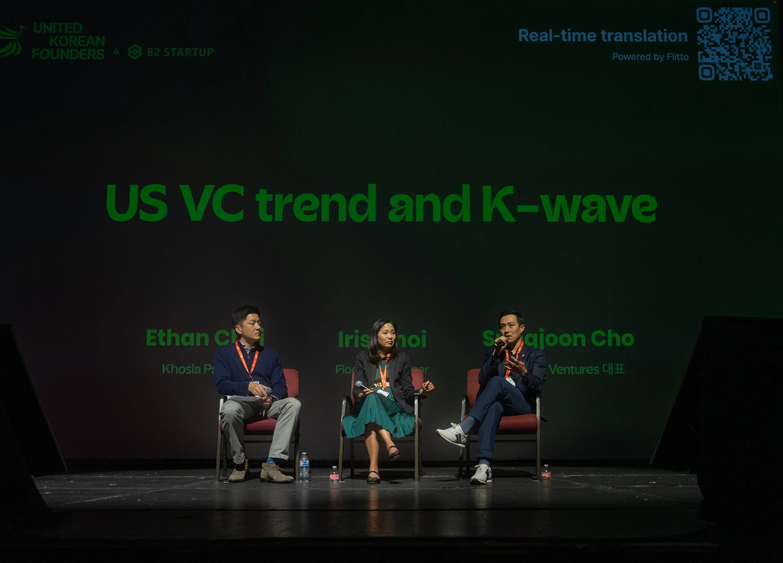 Panel discussion on 'US VC trend and K-wave' with three speakers seated on stage.