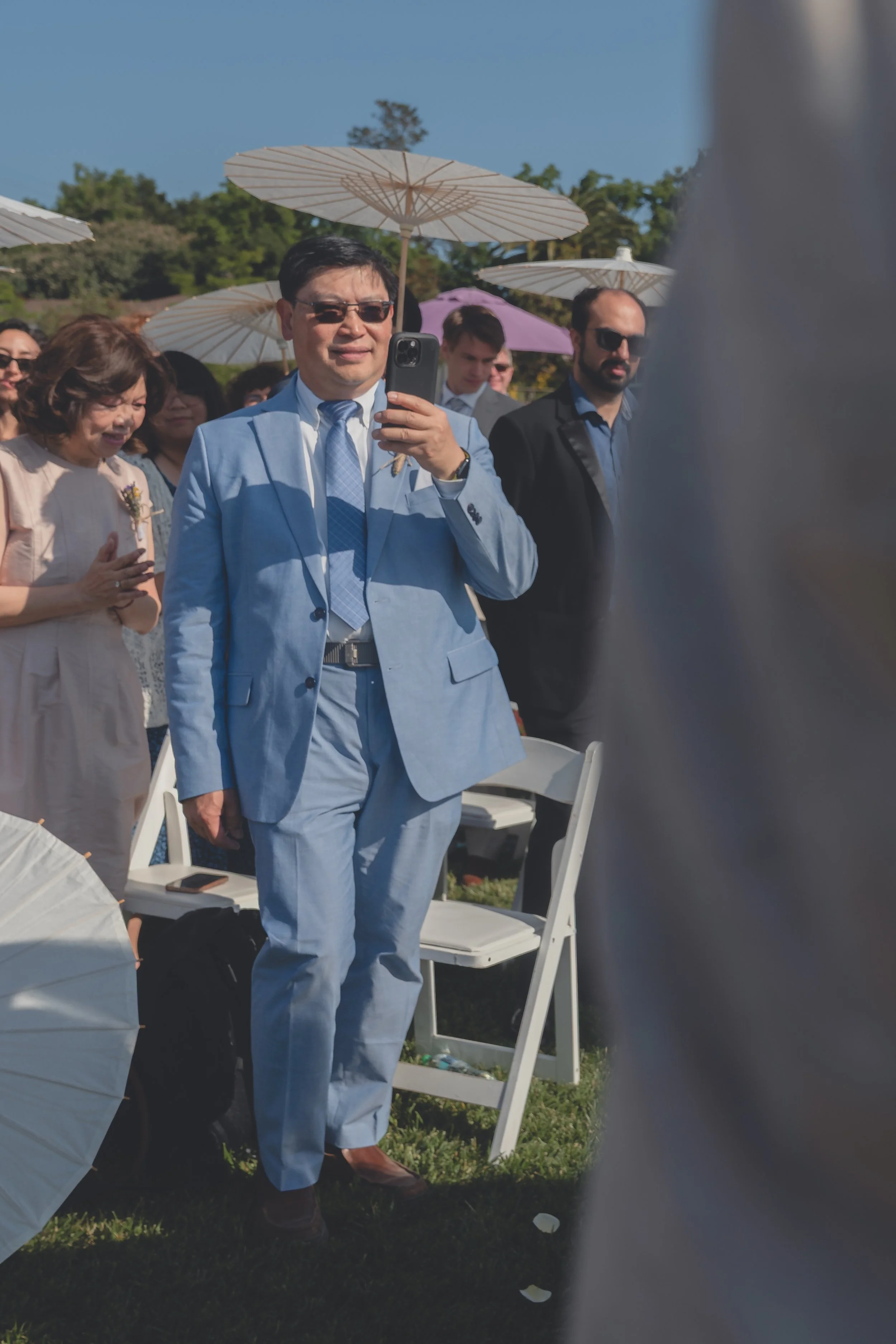 Bride arriving at the ceremony space as guests look on during Katherine and Calvin’s Sonoma wedding.