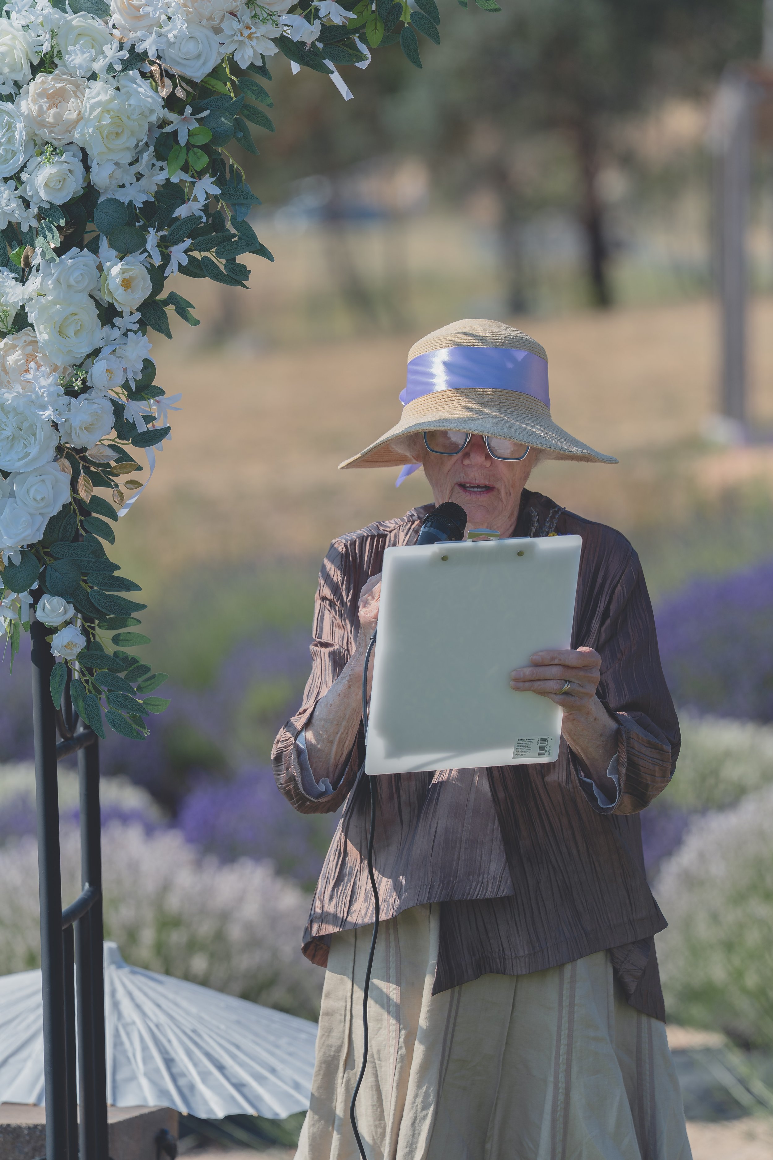 132. Officiant reading a wedding program during the Sonoma ceremony.