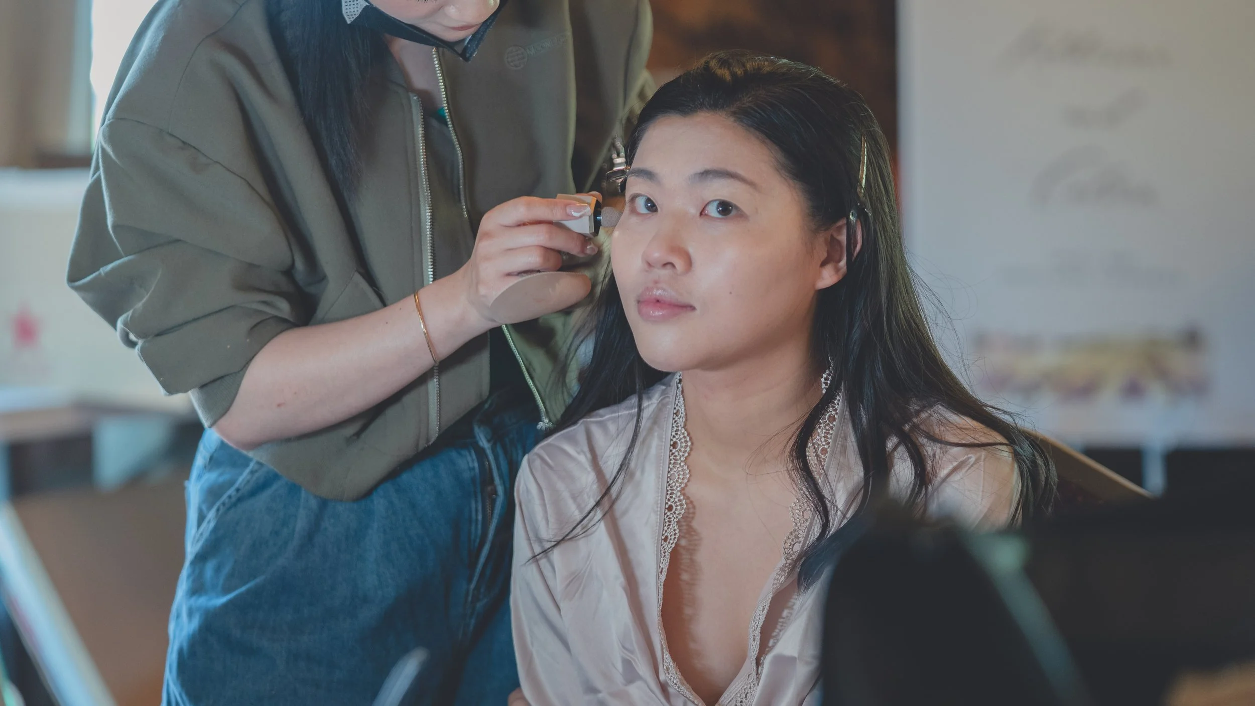 Bridemade seated in soft natural light during wedding preparations in Sonoma.
