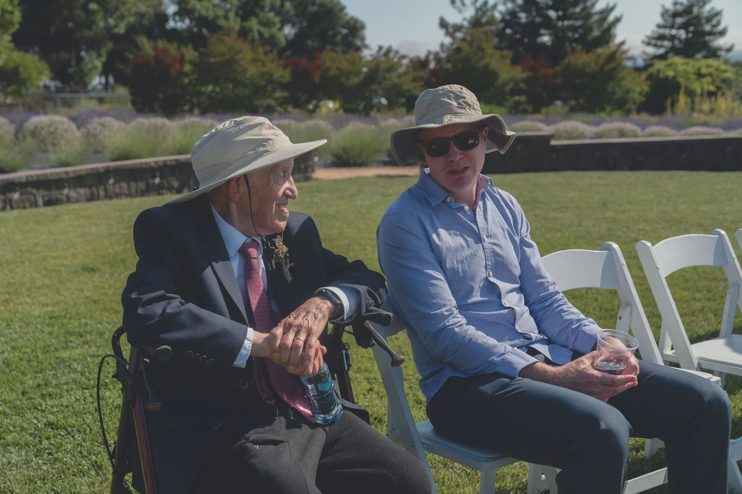 Guests seated in conversation before the ceremony begins at a Sonoma wedding.