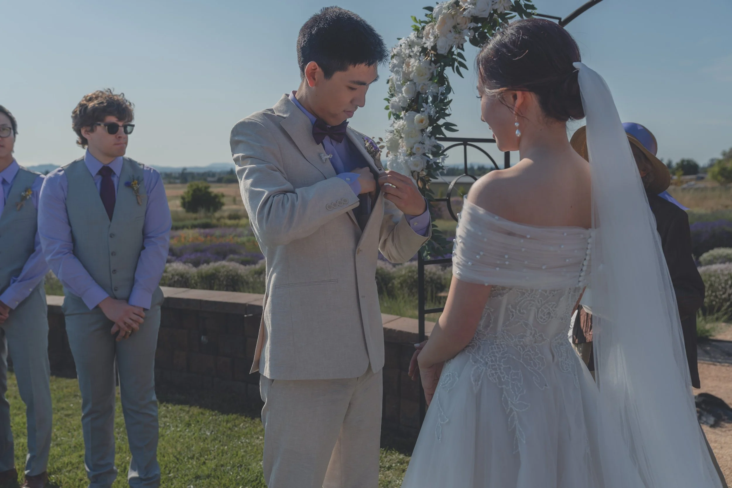 Bride and groom standing together as vows are shared in Sonoma.