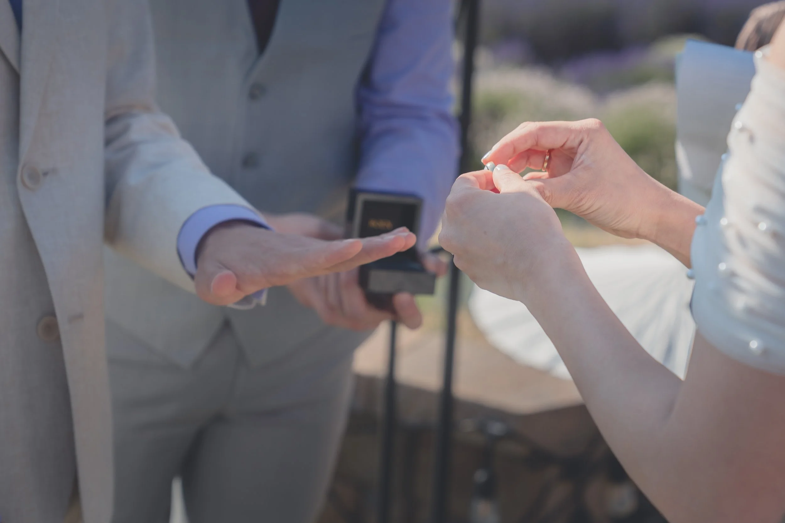 Close-up moment as rings are prepared during the ceremony in Sonoma.