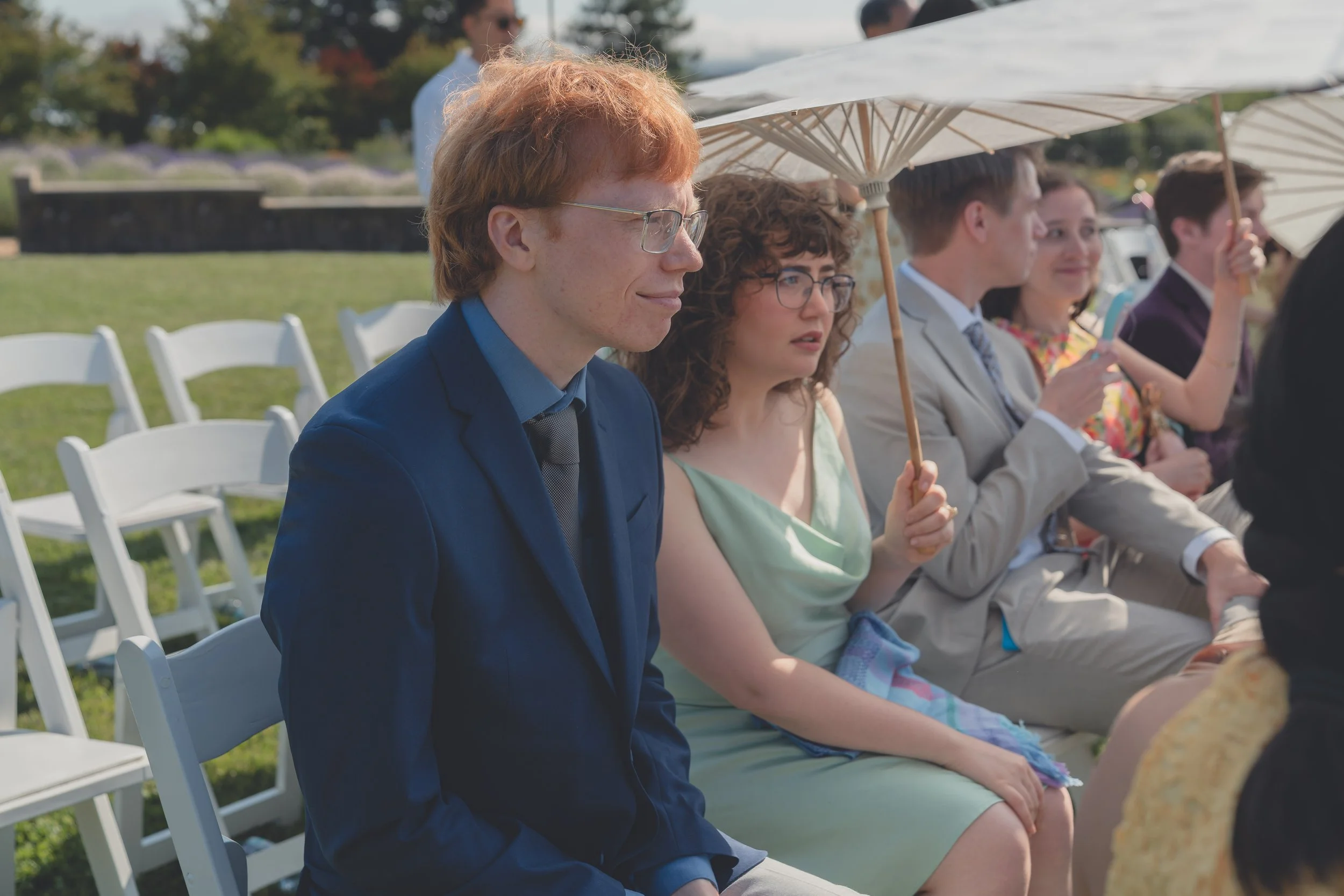 Guests seated and watching the ceremony unfold in California wine country.