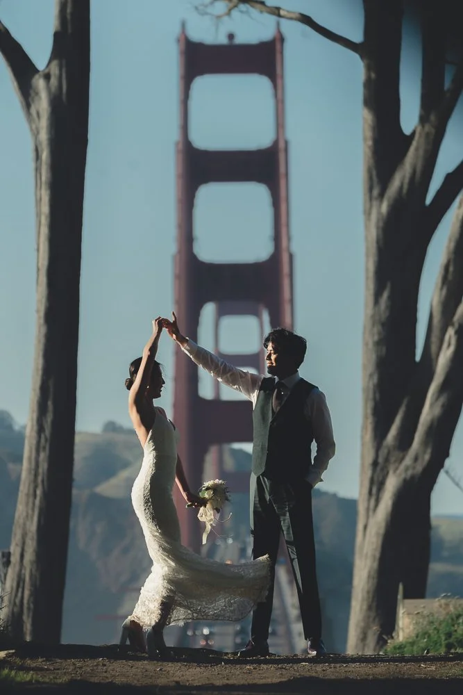 Couple dancing in front of Golden Gate Bridge