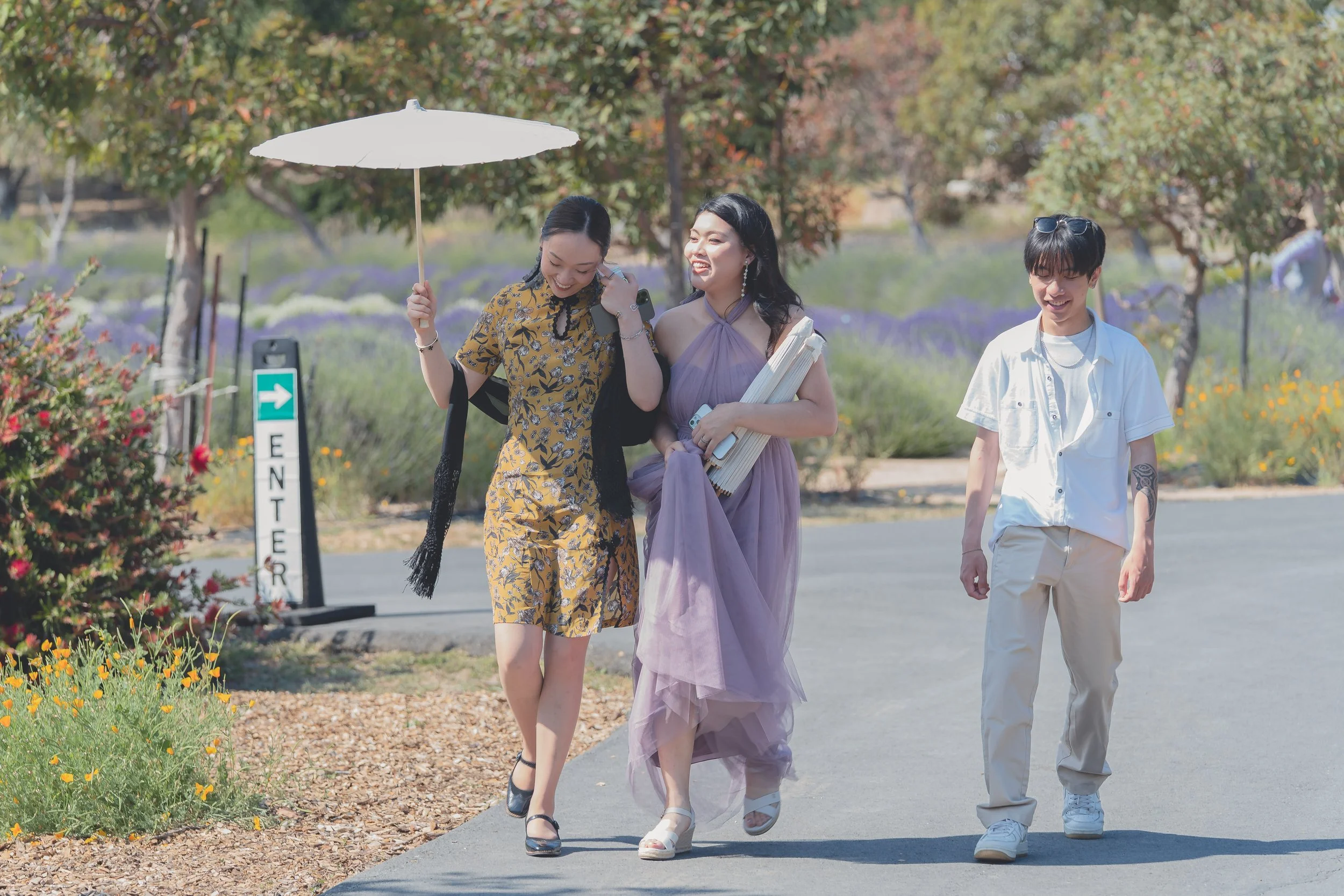 Guests walking together through the Sonoma wedding venue grounds.