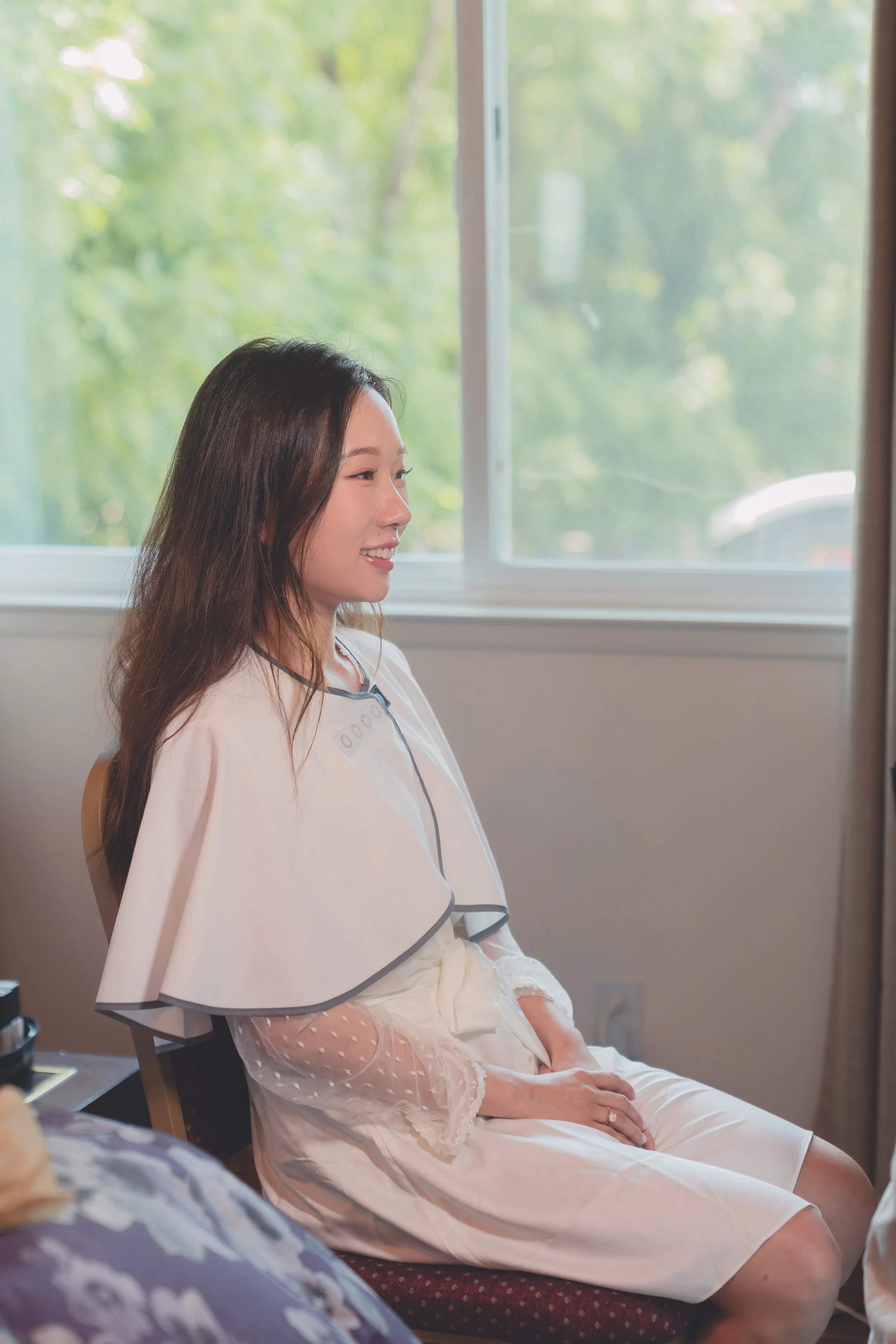 Bride seated in natural light during wedding preparations in Sonoma.