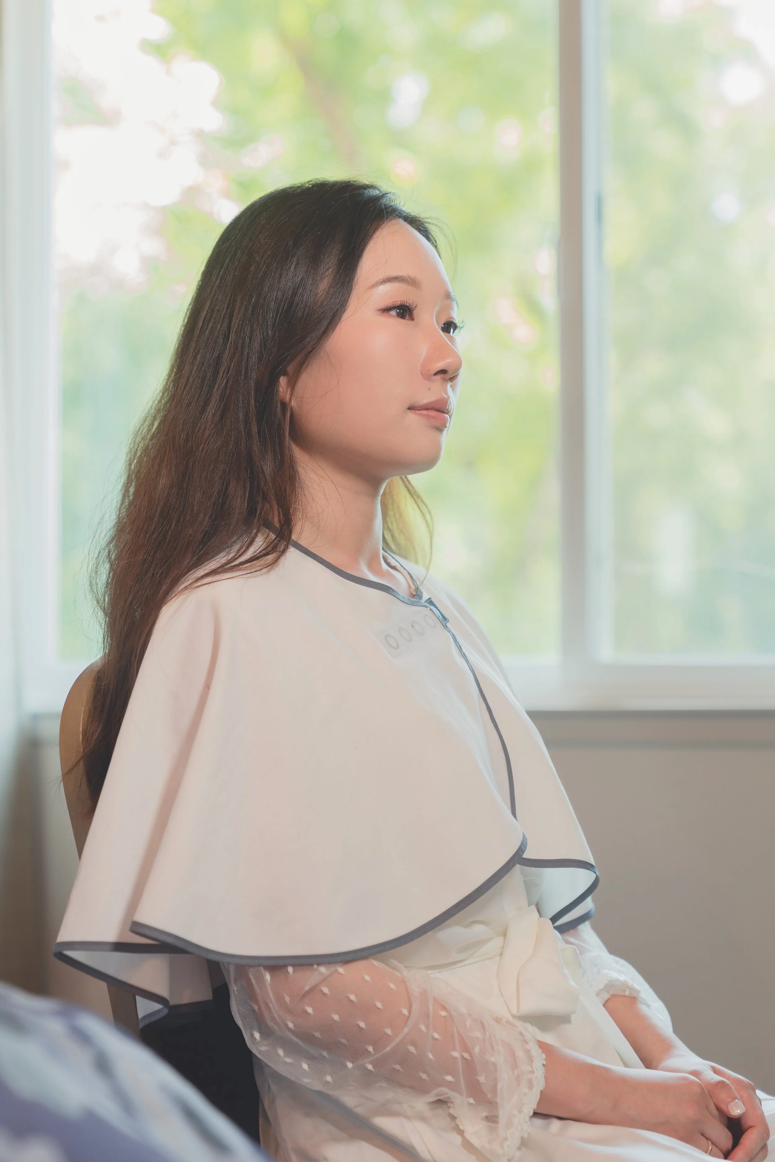 Natural bridal portrait photographed in soft window light at a Sonoma wedding.