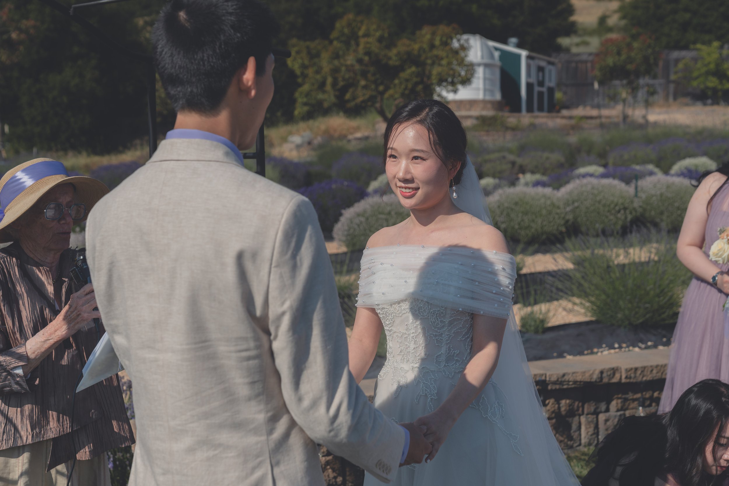 Bride and groom standing together during the wedding ceremony in Sonoma.