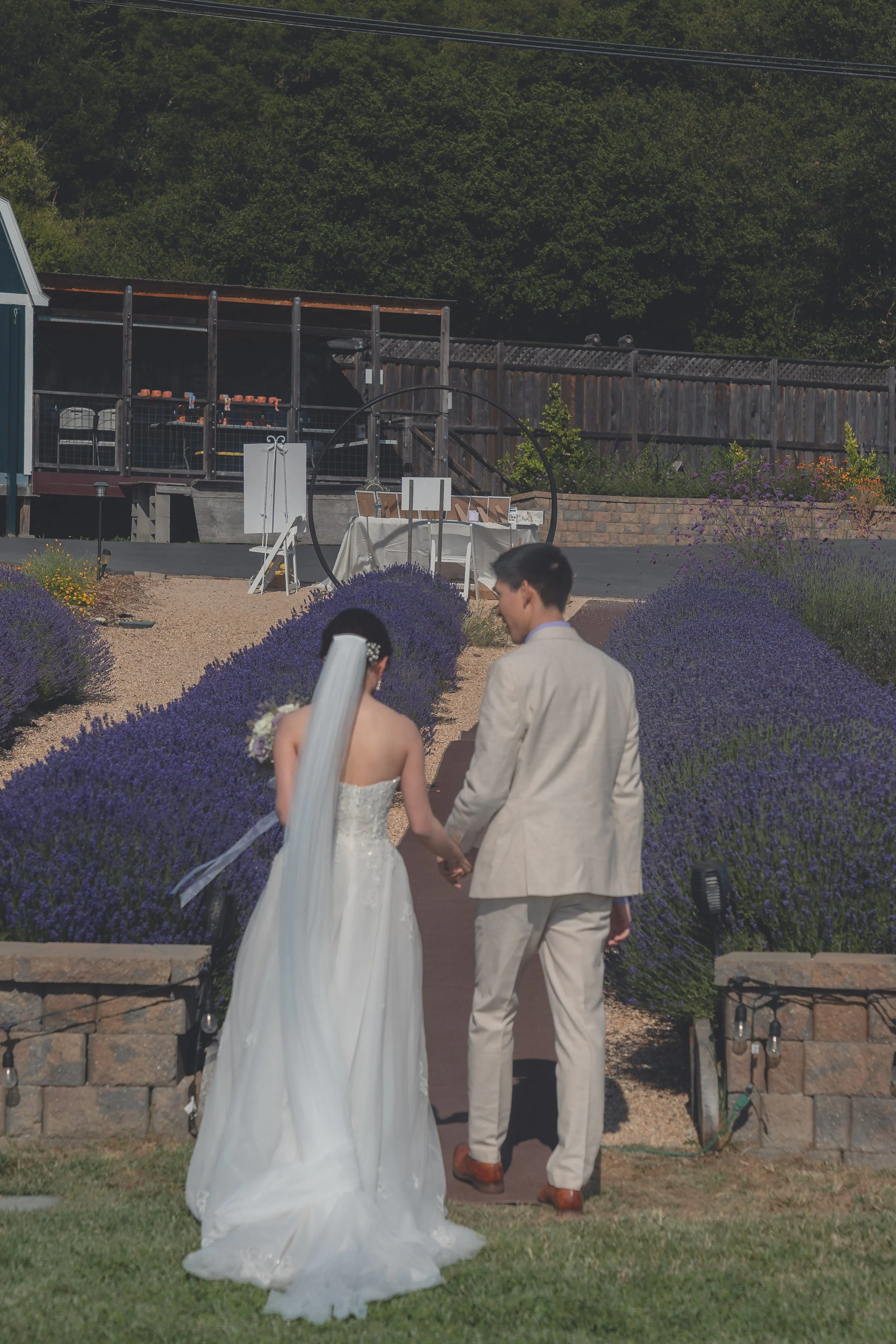 Bride and groom sharing a joyful moment during the recessional in California wine country.