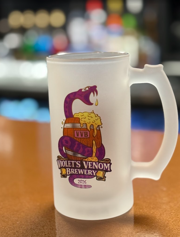 Frosted beer mug featuring a purple snake coiled around a wooden barrel with foam spilling over, labeled 'Violet's Venom Brewery 2026.'