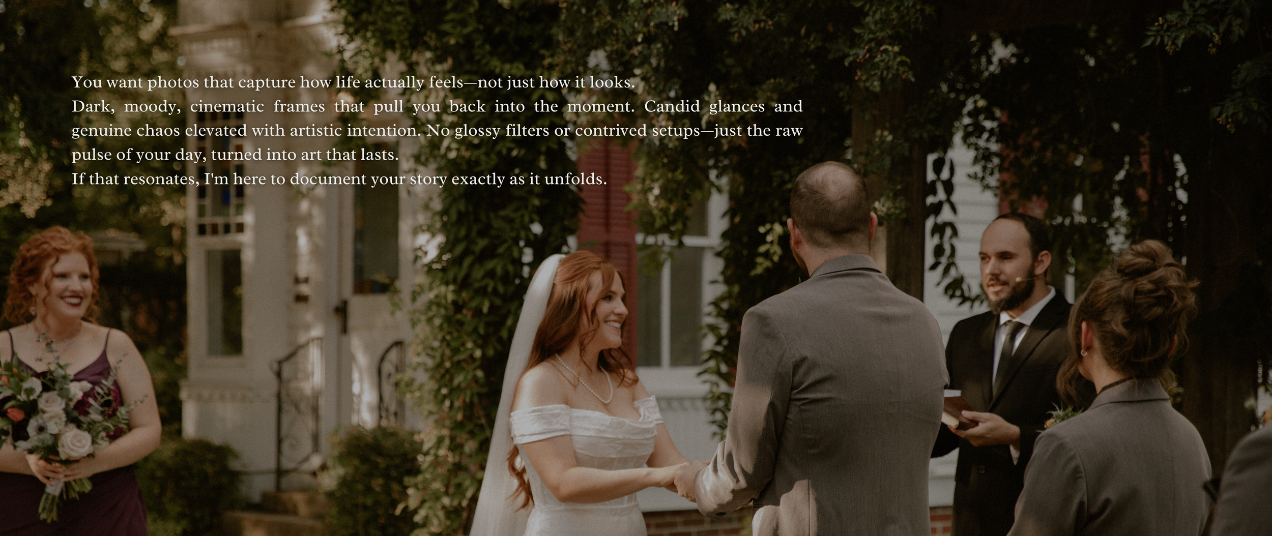 A wedding ceremony outdoors with a bride in a white dress and veil holding hands with the groom, surrounded by friends and family, in front of a white house with greenery. woodruff fontaine museum house. candid documentary photographer