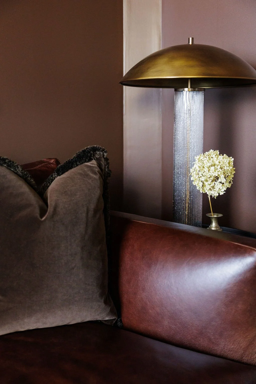 Local naperville interior designer MDLN Interiors near me with a custom sofa and custom furniture that has high-end and luxury decor and a vintage style