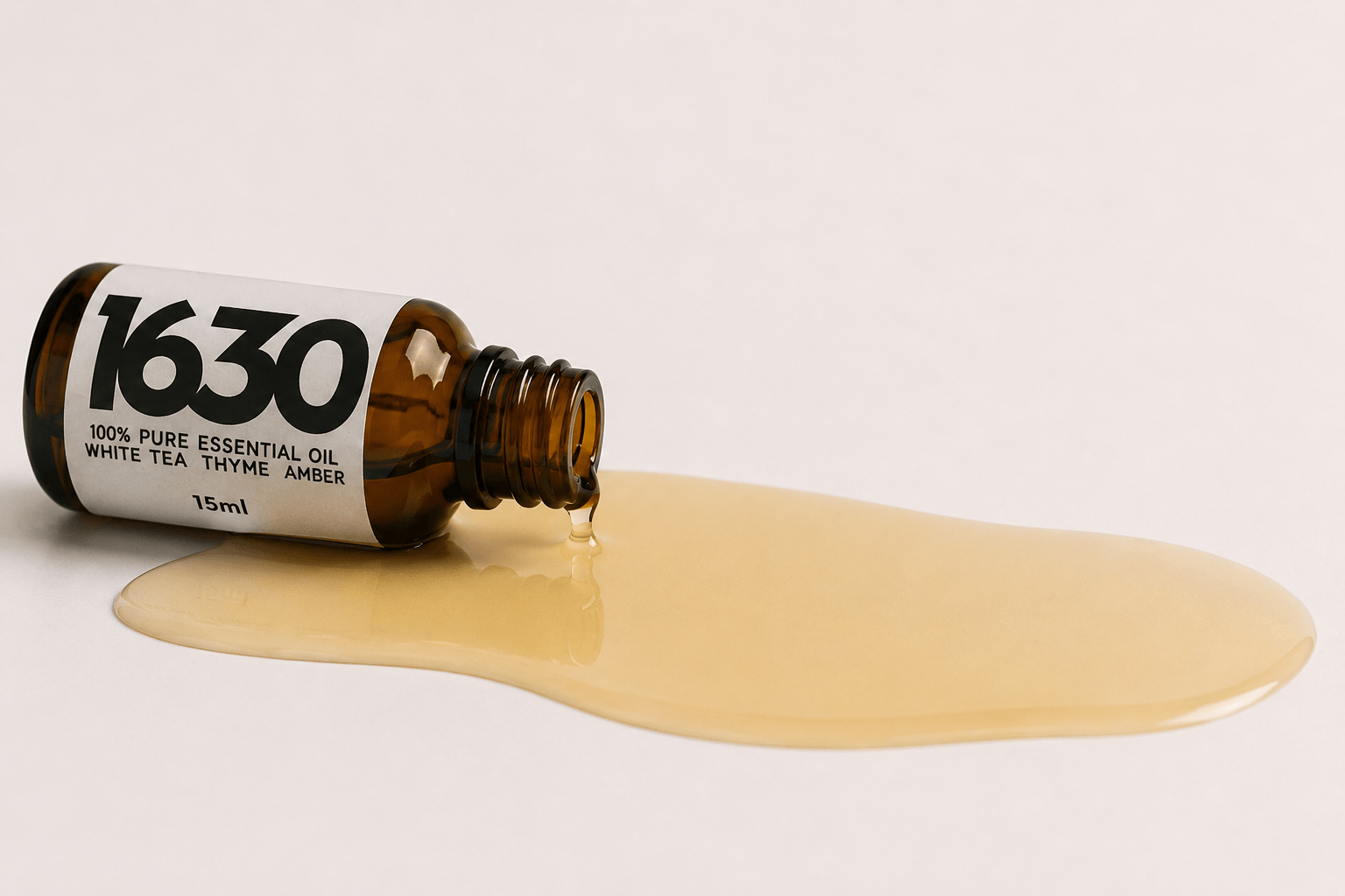 A 15ml bottle of 1630 pure essential oil turned on its side and spilling out.
