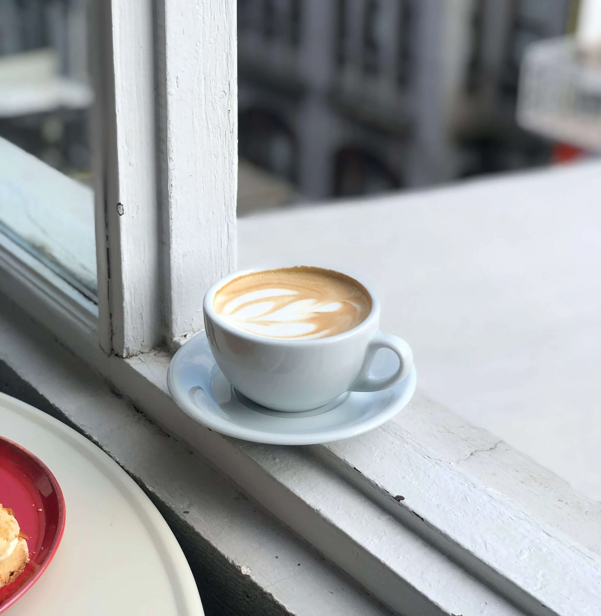 A coffee cup at a cafe in Victoria, BC that is used to represent the smell of 1630 scent essential oil