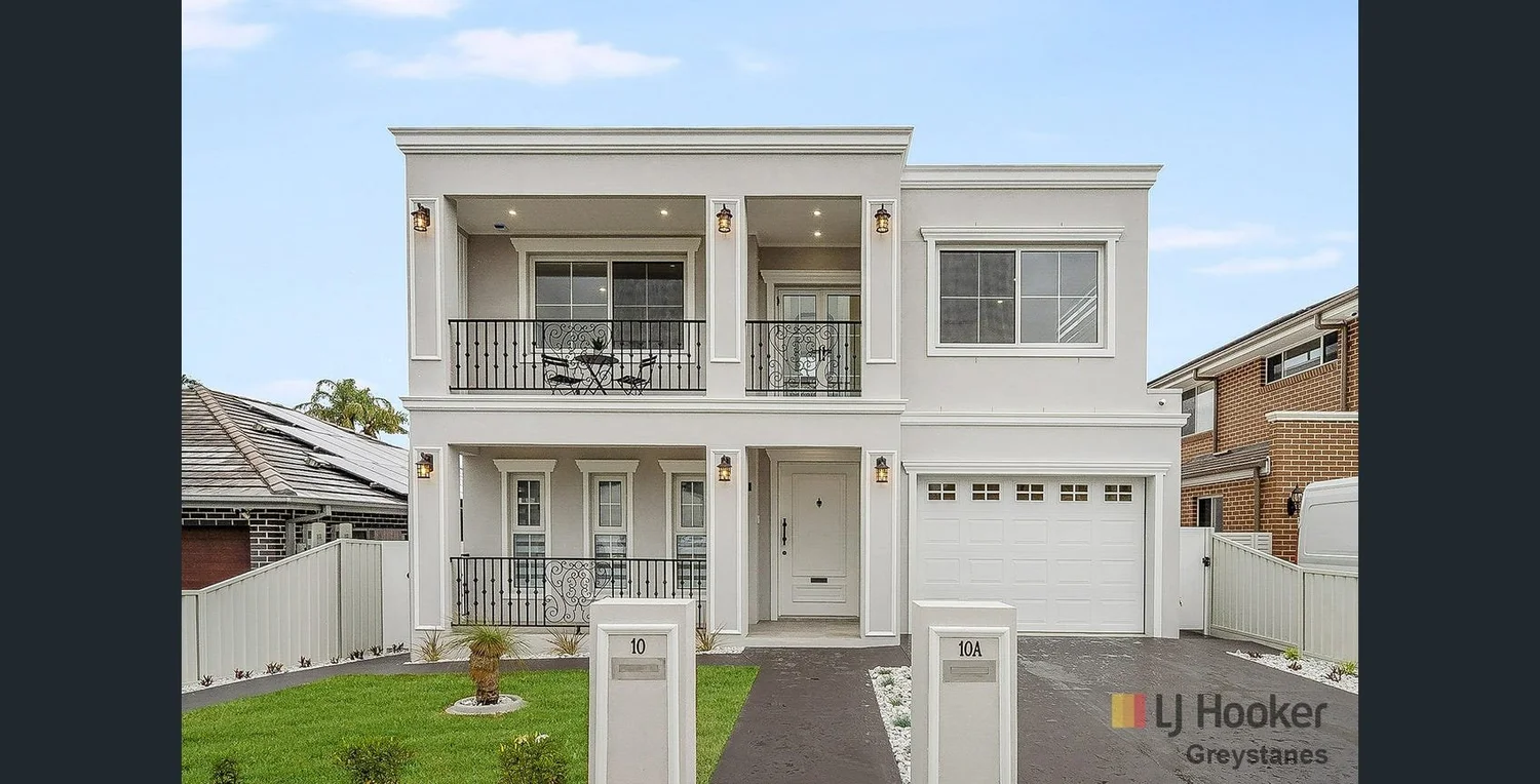 Modern ranch-style home with stone base and metal roof