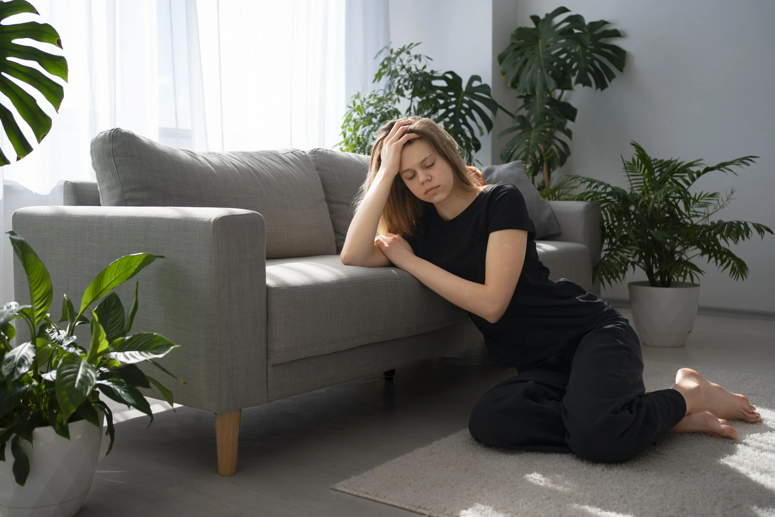 Person experiencing repetitive thoughts and compulsive behaviors related to OCD symptoms.