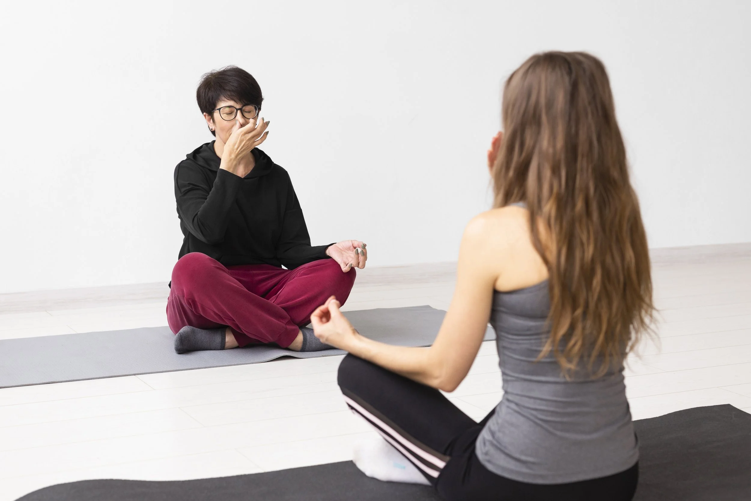 Client discussing ADHD challenges and daily systems with therapist during counseling session.